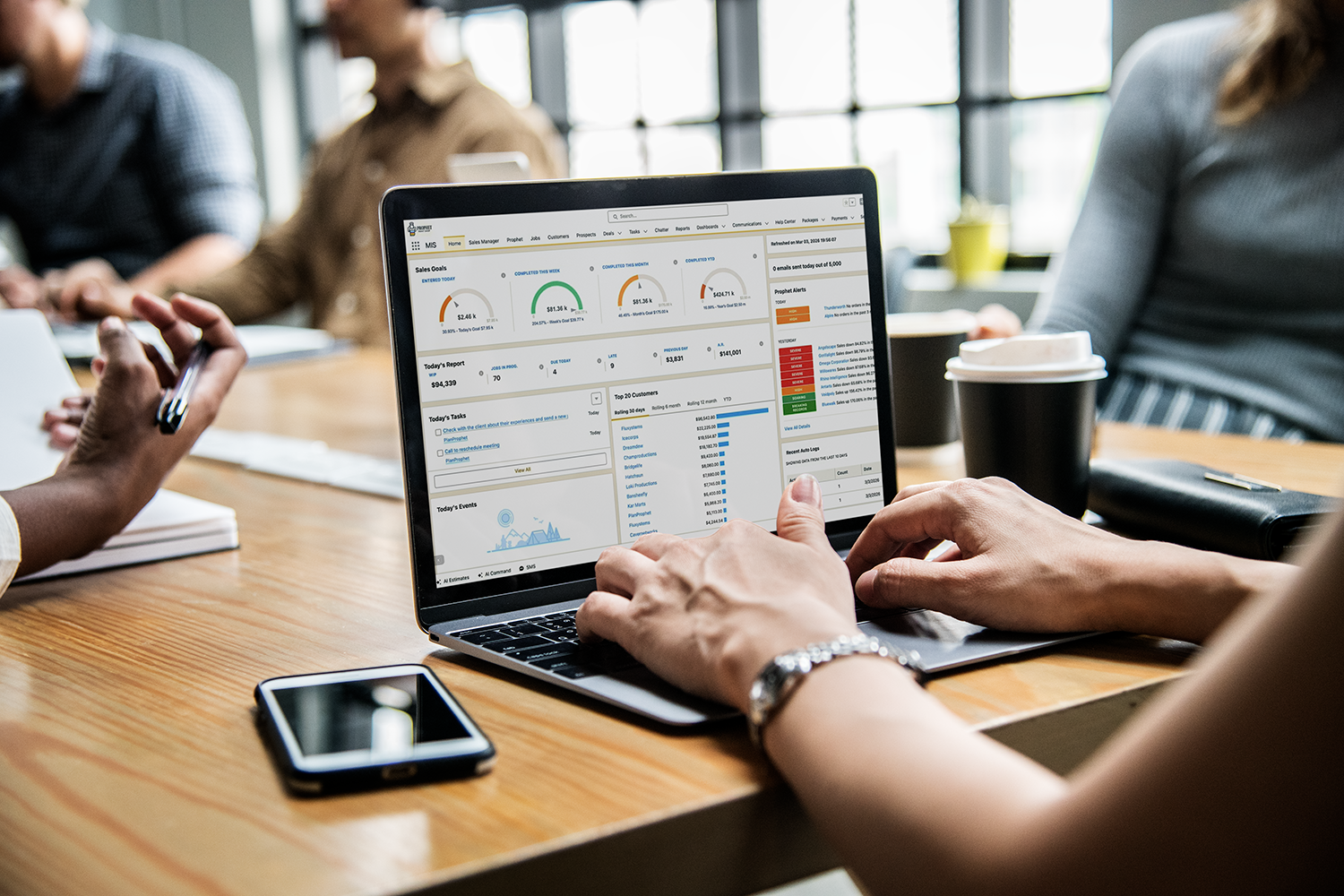 A office laptop showing the PlanProphet dashboard