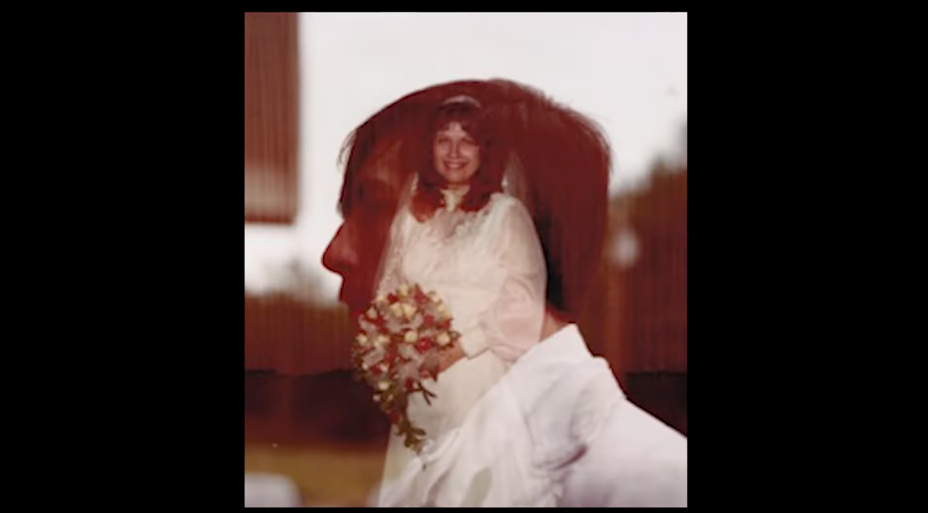 A double exposure photo of a woman with red hair holding a bouquet of flowers, and a man with a blurred profile in the foreground.