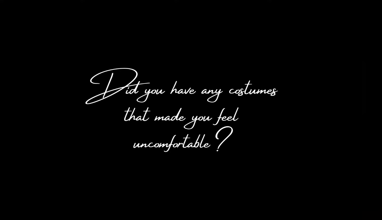 A black background with white handwritten style text asking, "Did you have any costumes that made you feel uncomfortable?"