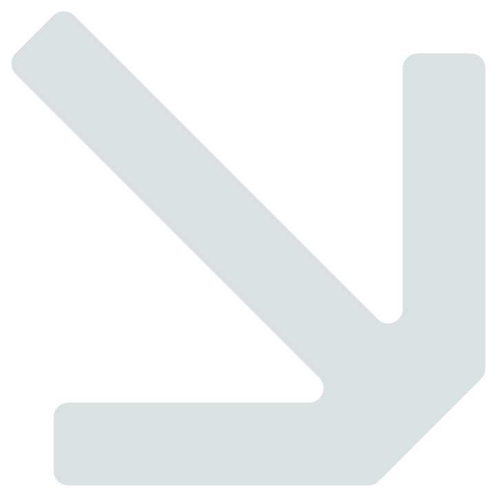 A downward-pointing arrow sign in light gray
