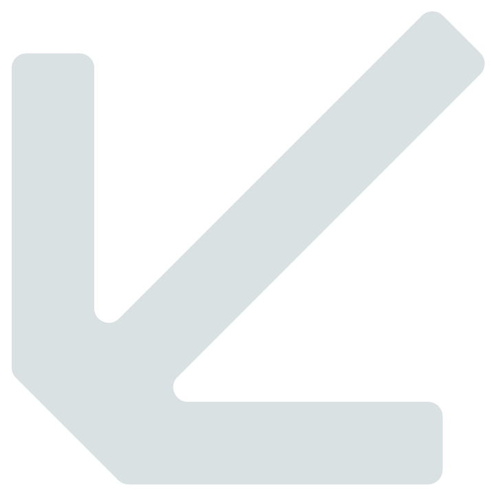 A downward pointing arrow sign in light gray color.