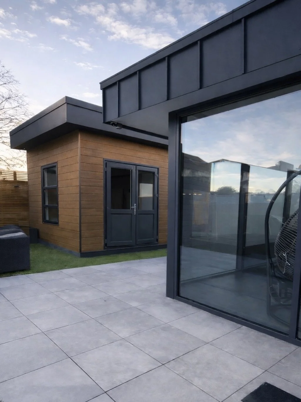Designed to complement the main home while still standing confidently on its own.

This modular building was carefully designed to mirror the modern style of the house - matching colours, clean lines, and contemporary finishes - while still having it