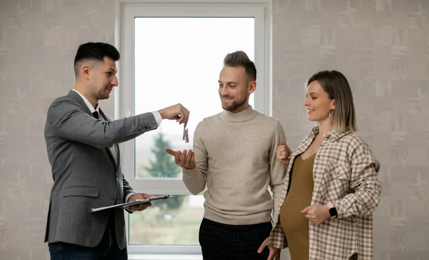 realtor closing another sale with happy homebuyers