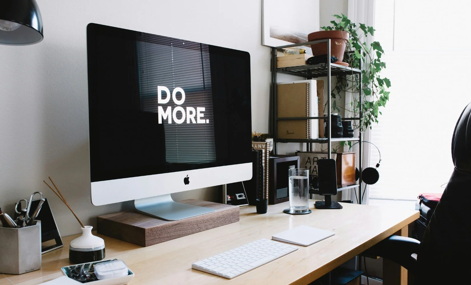 Desktop Computer in real estate home office displays words Do More