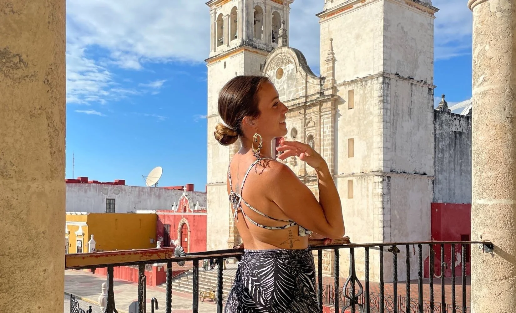 Enjoying digital nomad life posing in front of a cathedral on a road-trip to Campeche City, Mexico