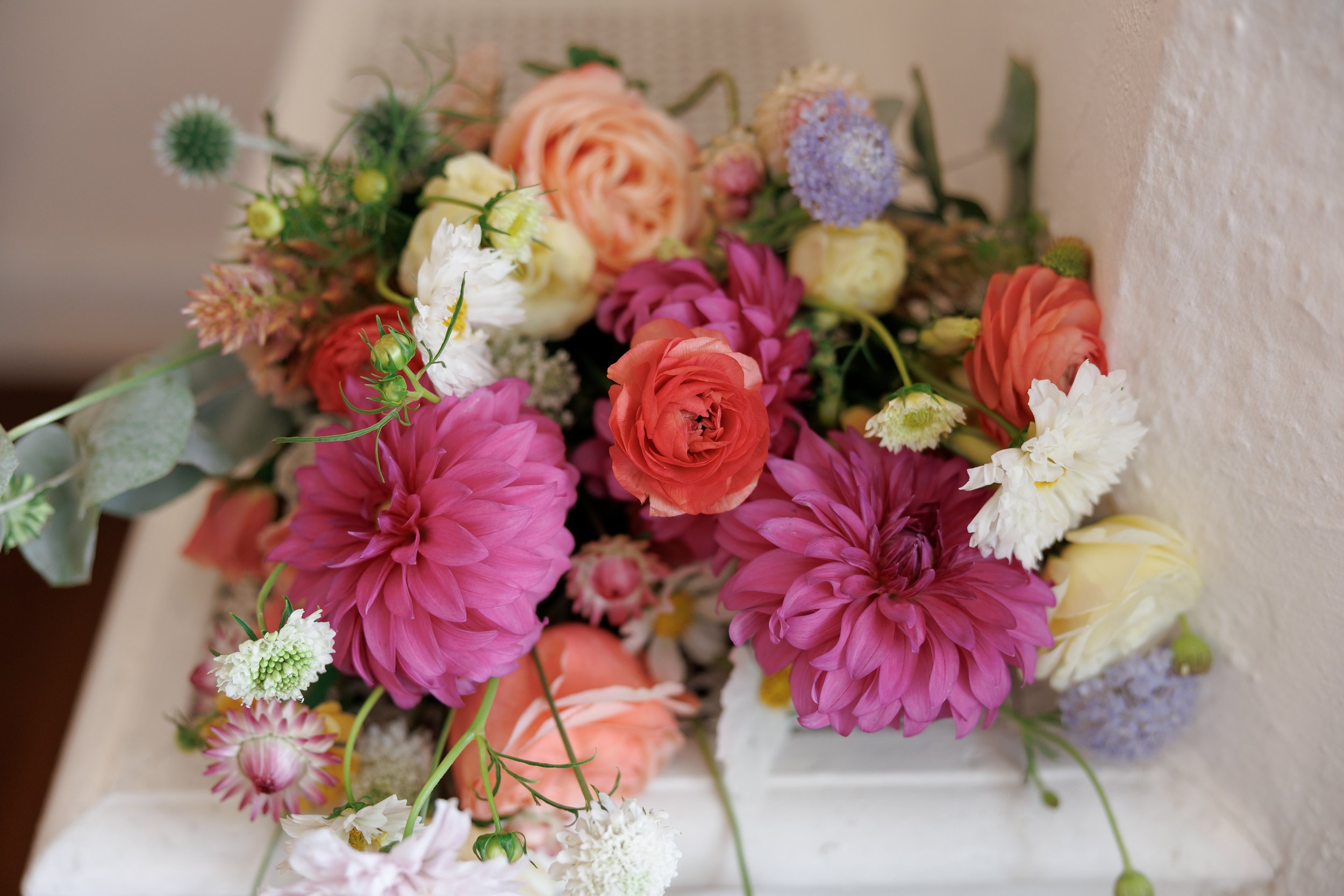 Bridal bridal bouquet featuring bright color flowers.