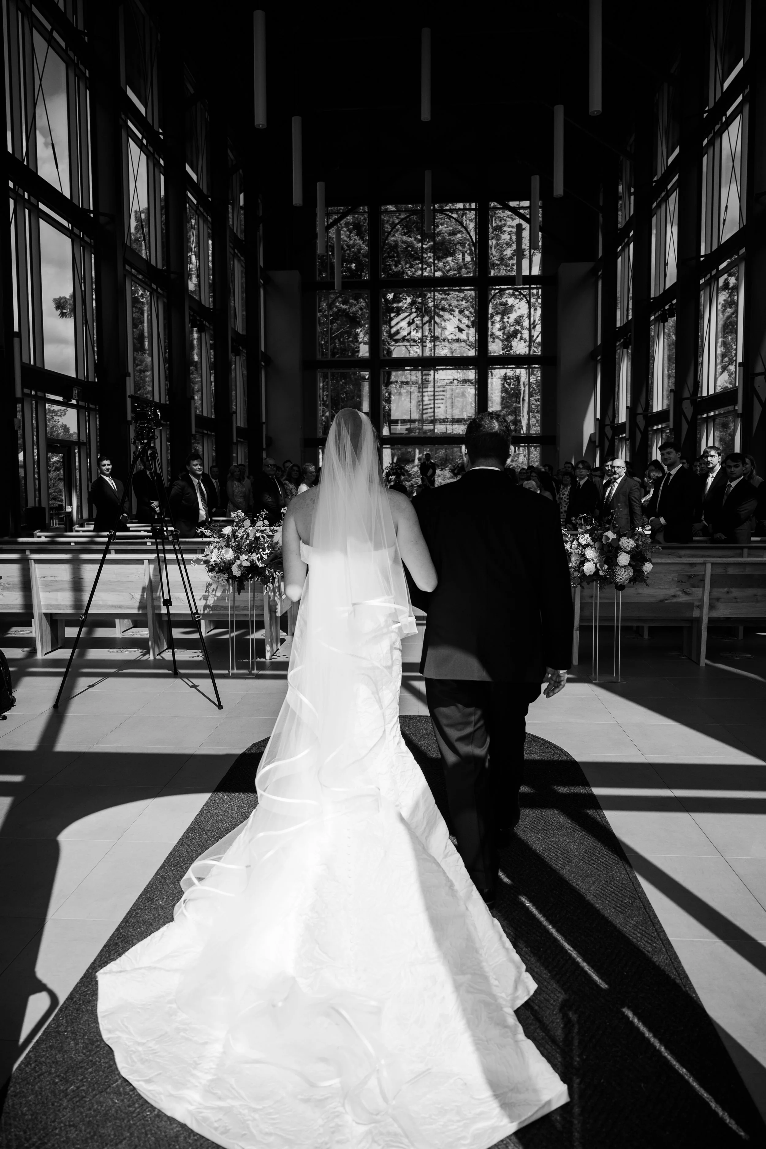 The walk down the aisle with father of the bride and the bride. 