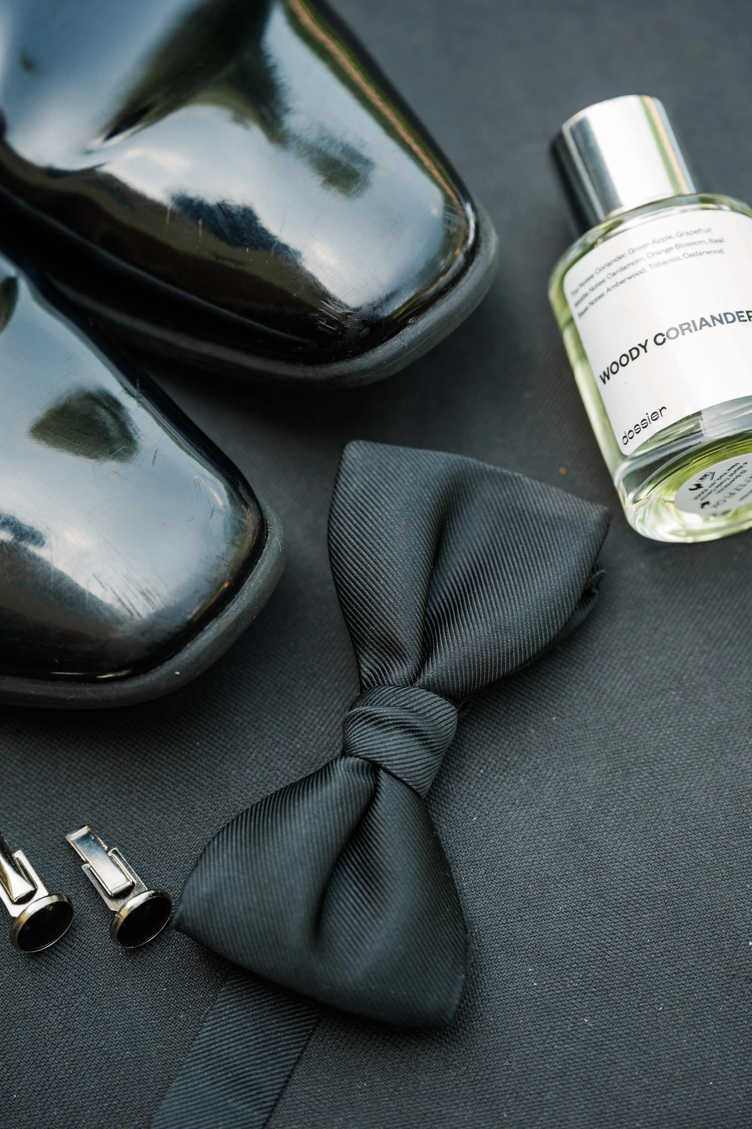 Groom’s wedding day accessories styled before an elegant Cincinnati wedding.