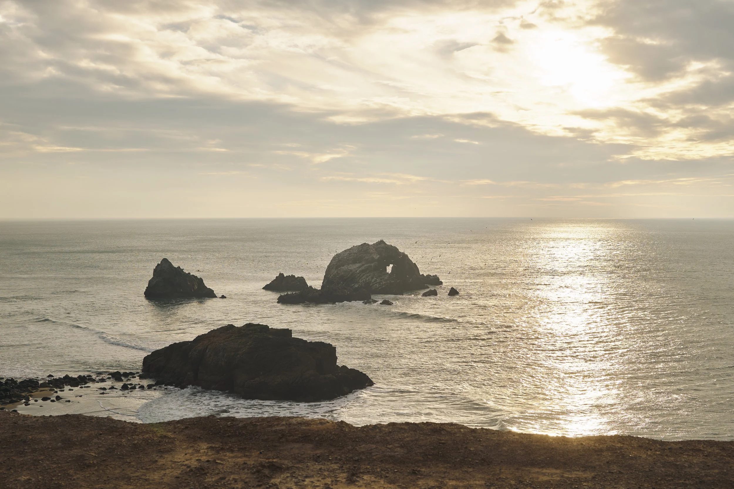Seal Rocks and the Pacific Ocean from the Sutro Baths overlook at golden hour