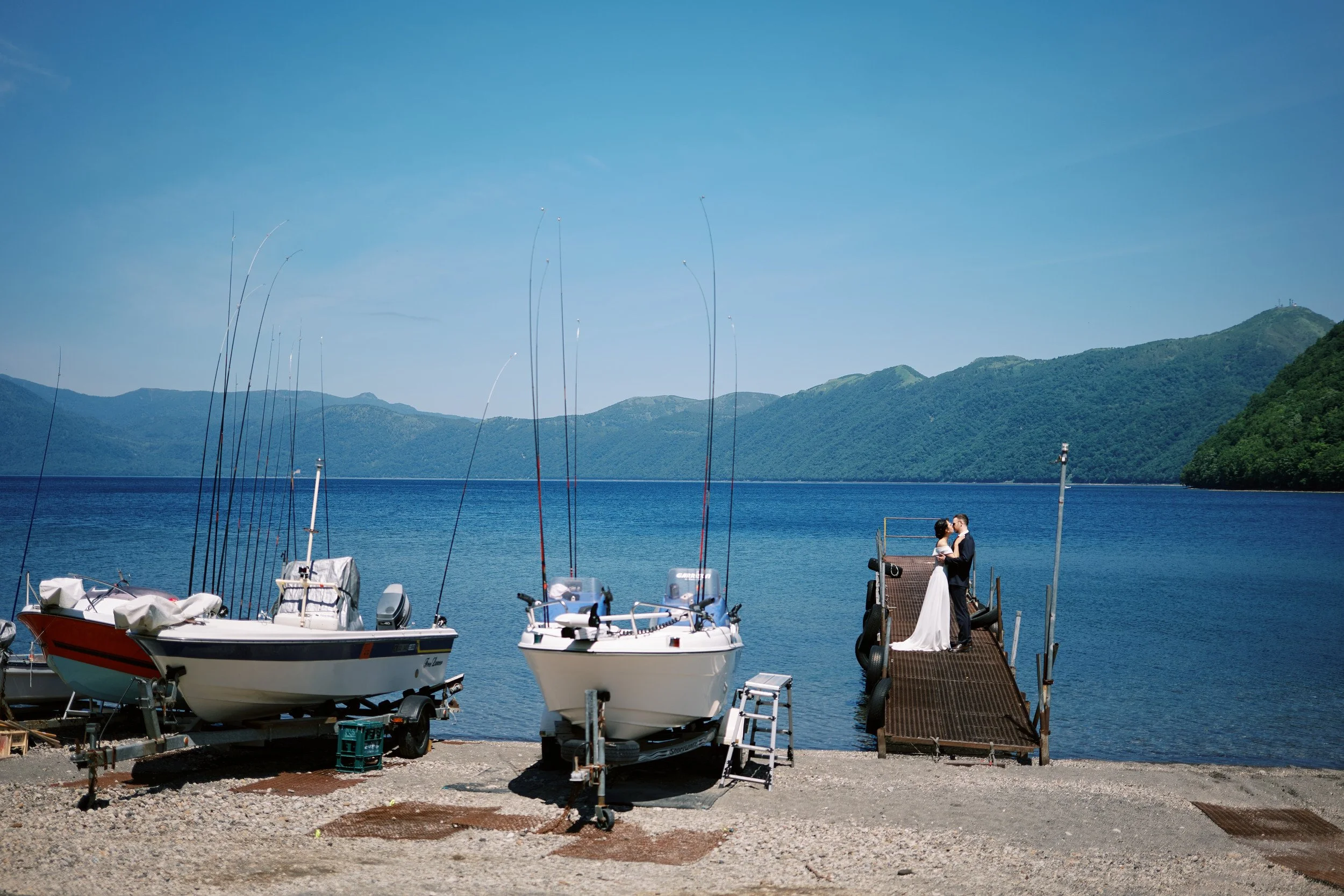 Quiet embrace by the still water of Lake Shikotsu in early summer