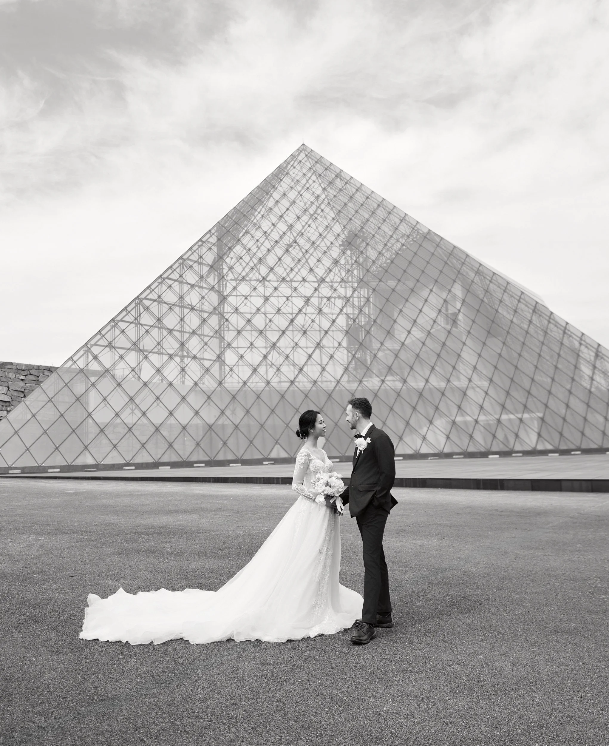 Portrait against the clean lines of the Moerenuma Park glass pyramid