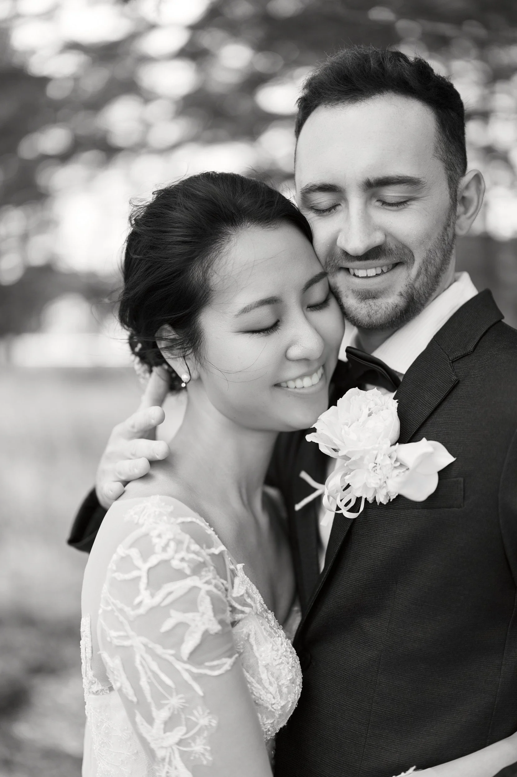 Bride and groom among the trees at Moerenuma Park in soft filtered light