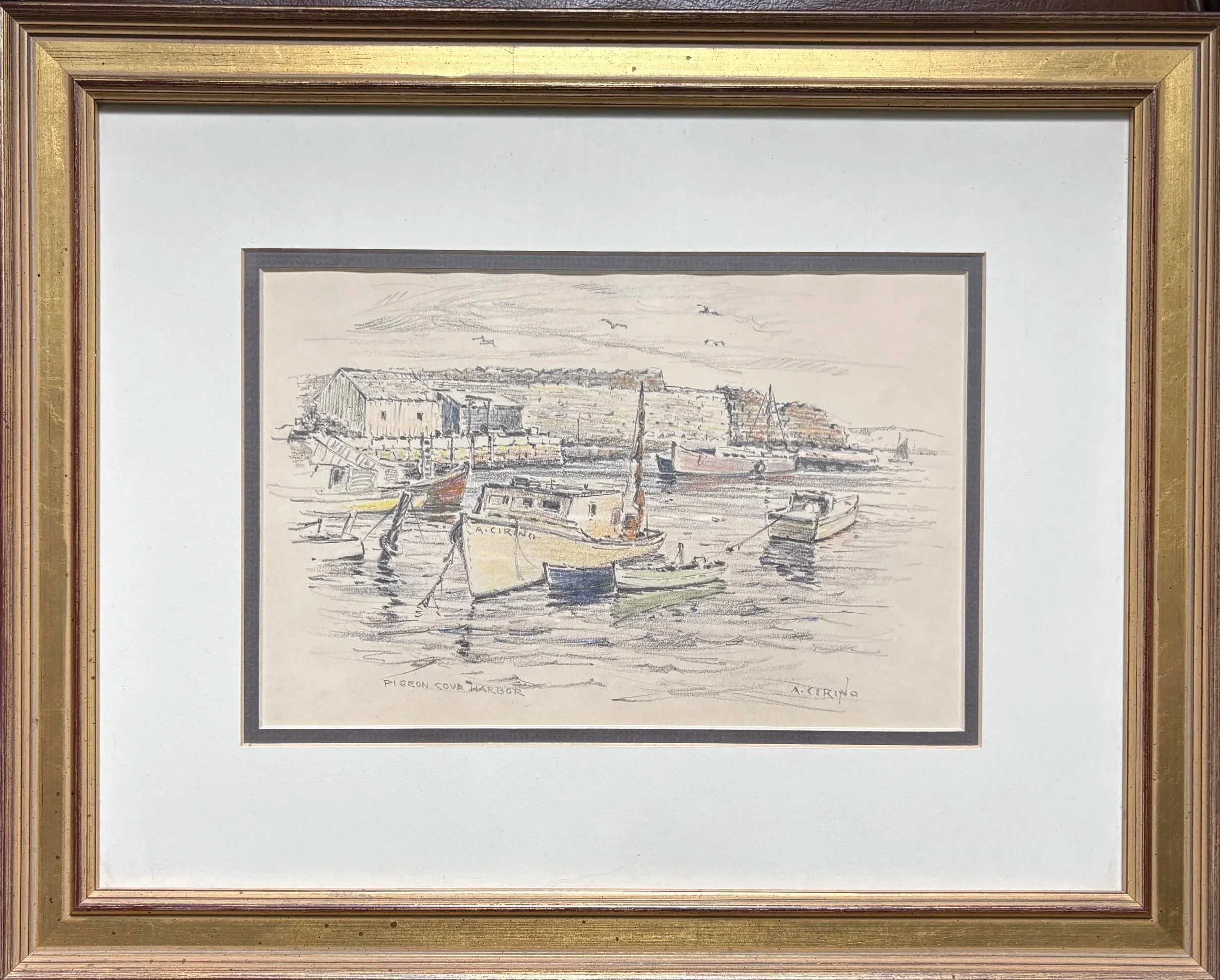 A framed watercolor painting of a harbor scene with boats and buildings, signed 'A. Curino'.