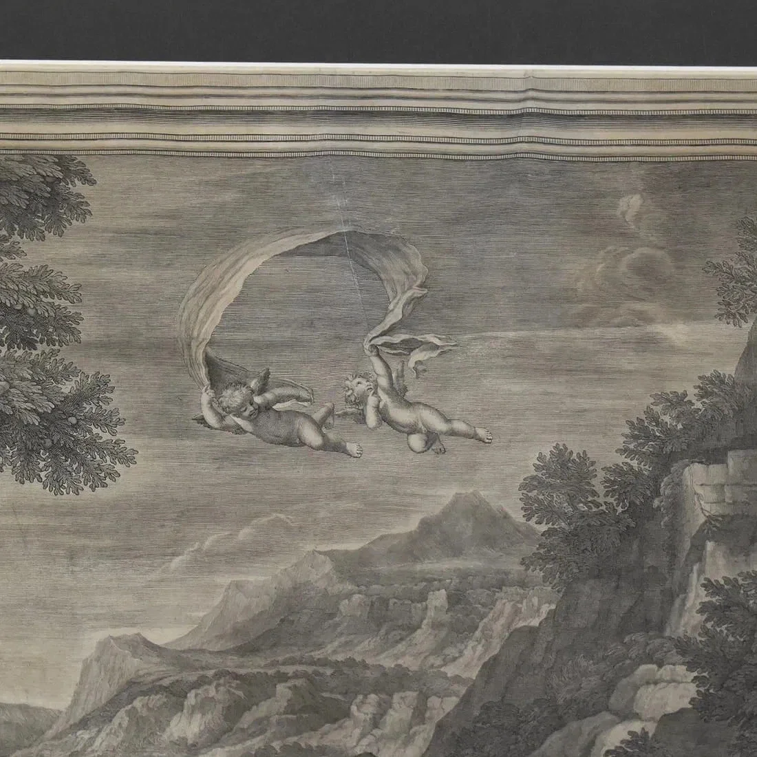 A black and white drawing of two cherubs flying in the sky, holding a large cloth or banner. There are trees, mountains, and clouds in the background.