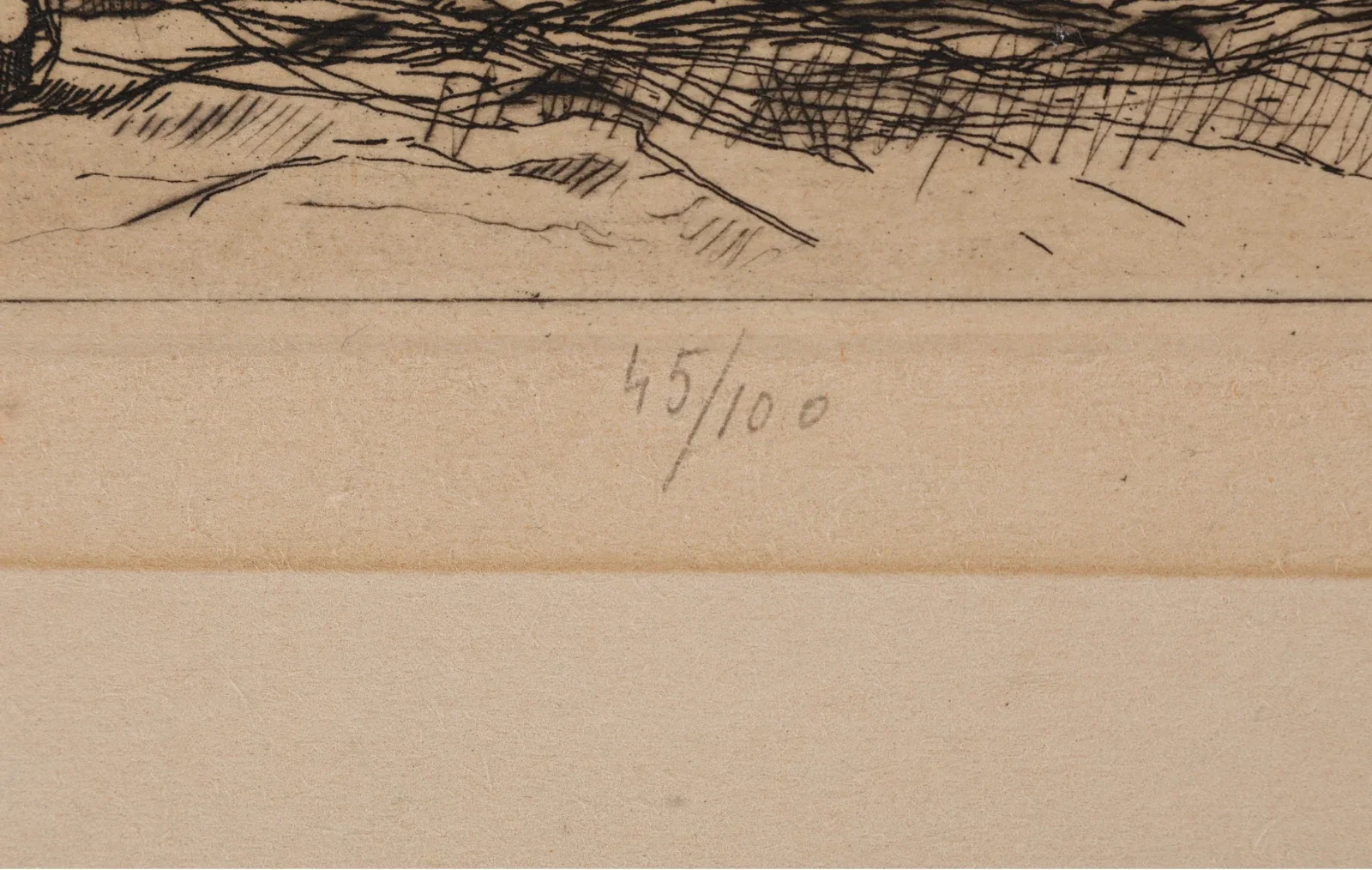 Close-up of a handwritten edition number '45/100' on the back of an artwork, with part of a sketch visible above.