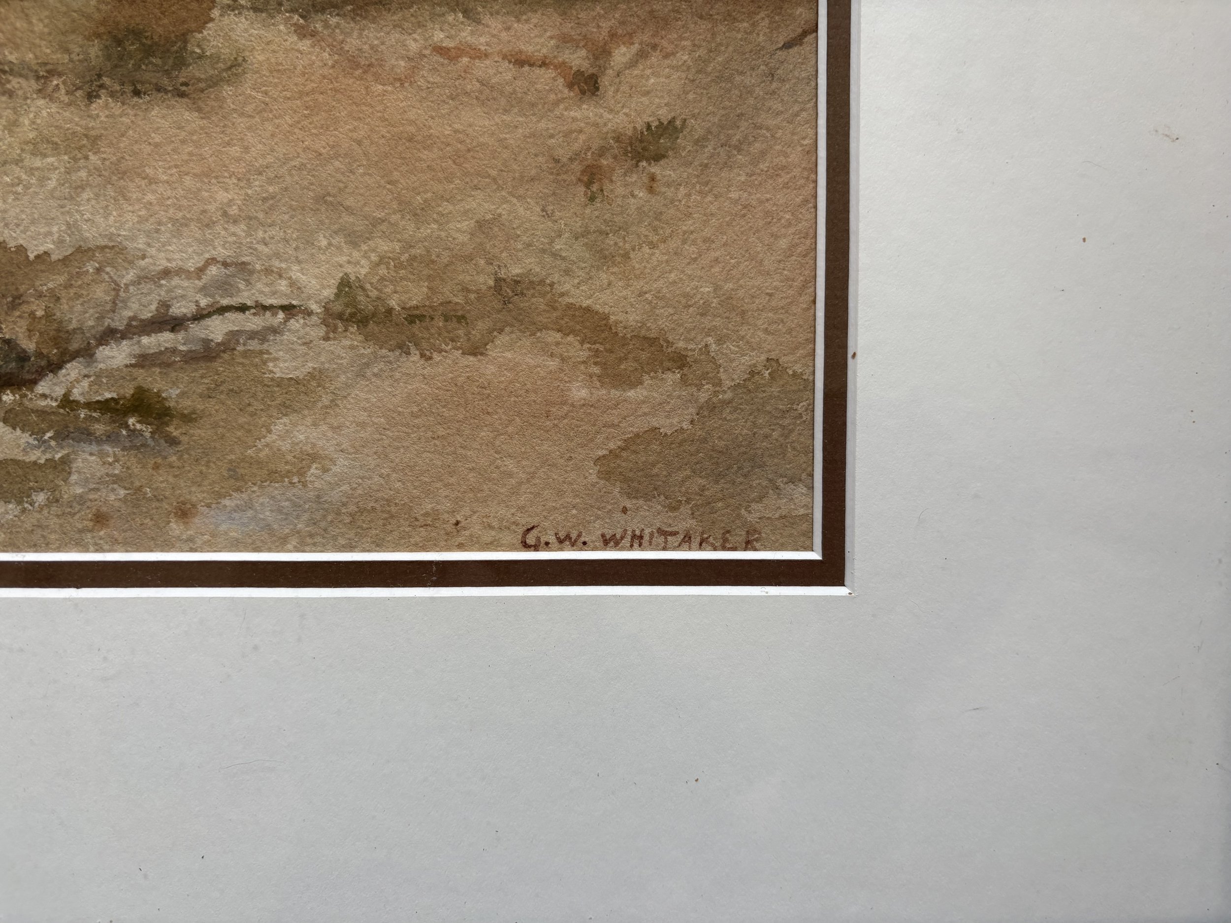 Close-up of watercolor landscape painting on paper, signed by G. W. Whitaker.