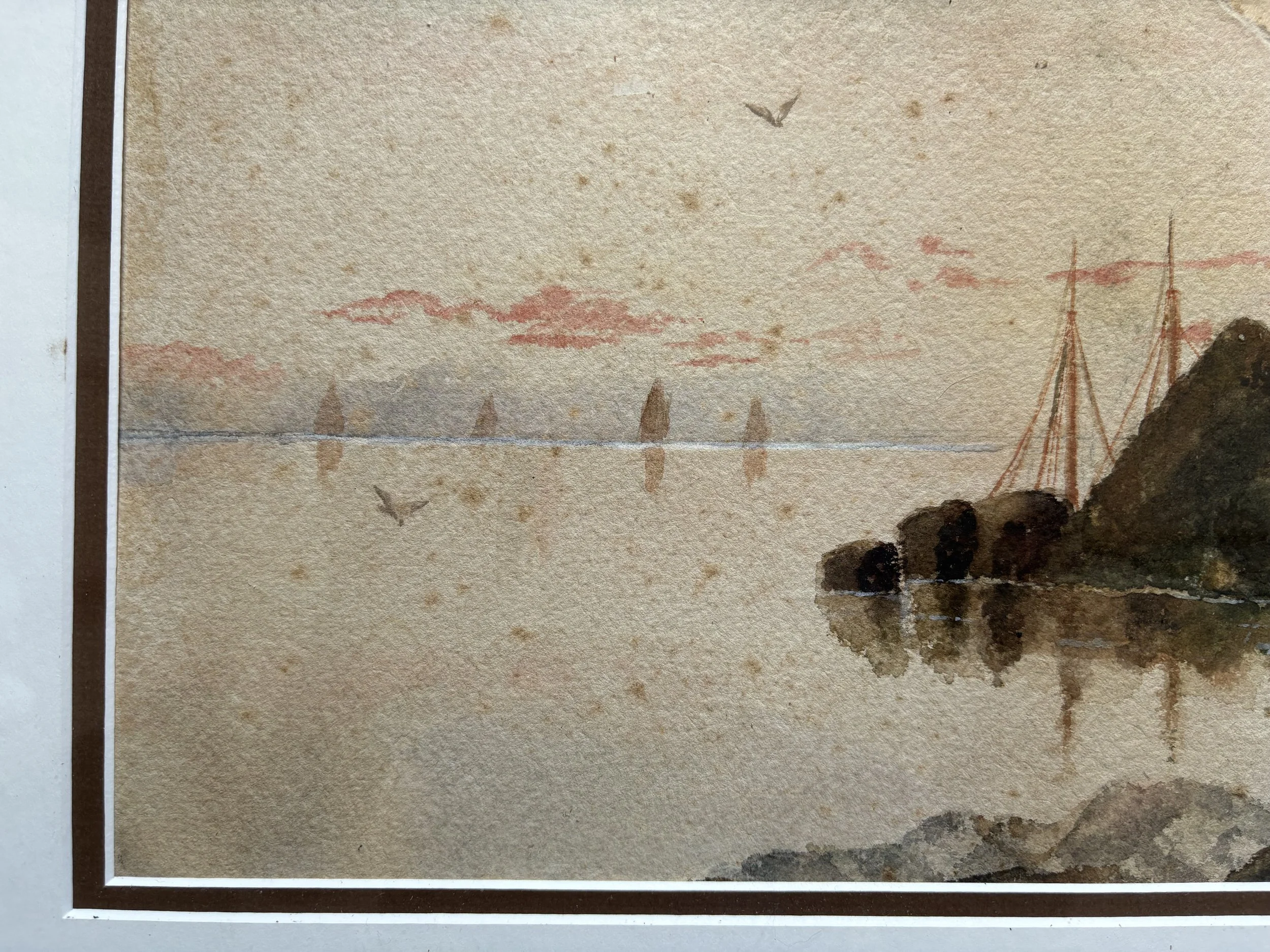 A watercolor painting depicting a landscape with sailboats on water, mountains in the background, pink sunset or sunrise sky, and birds flying overhead.