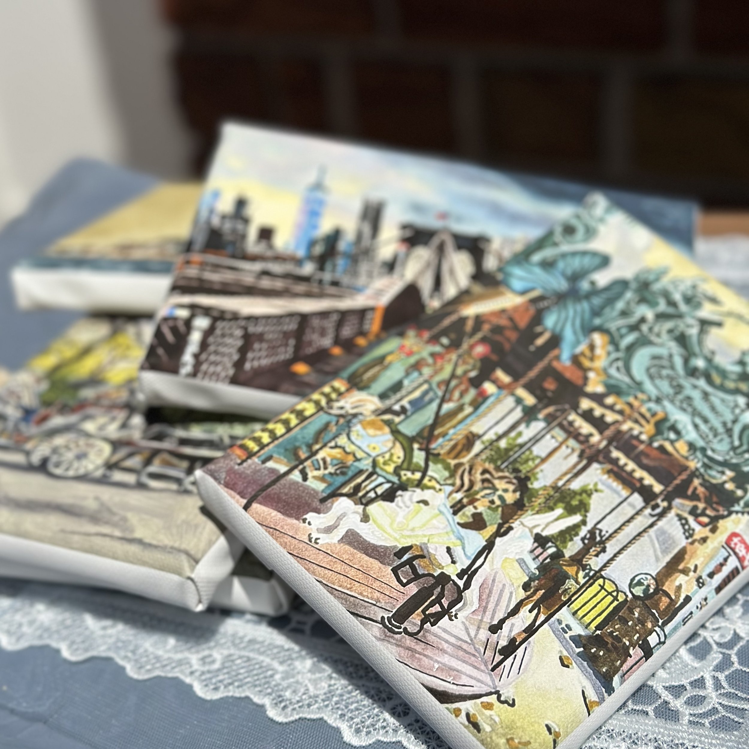 Close-up of colorful illustrated pages of a book or magazine with a blurred background.