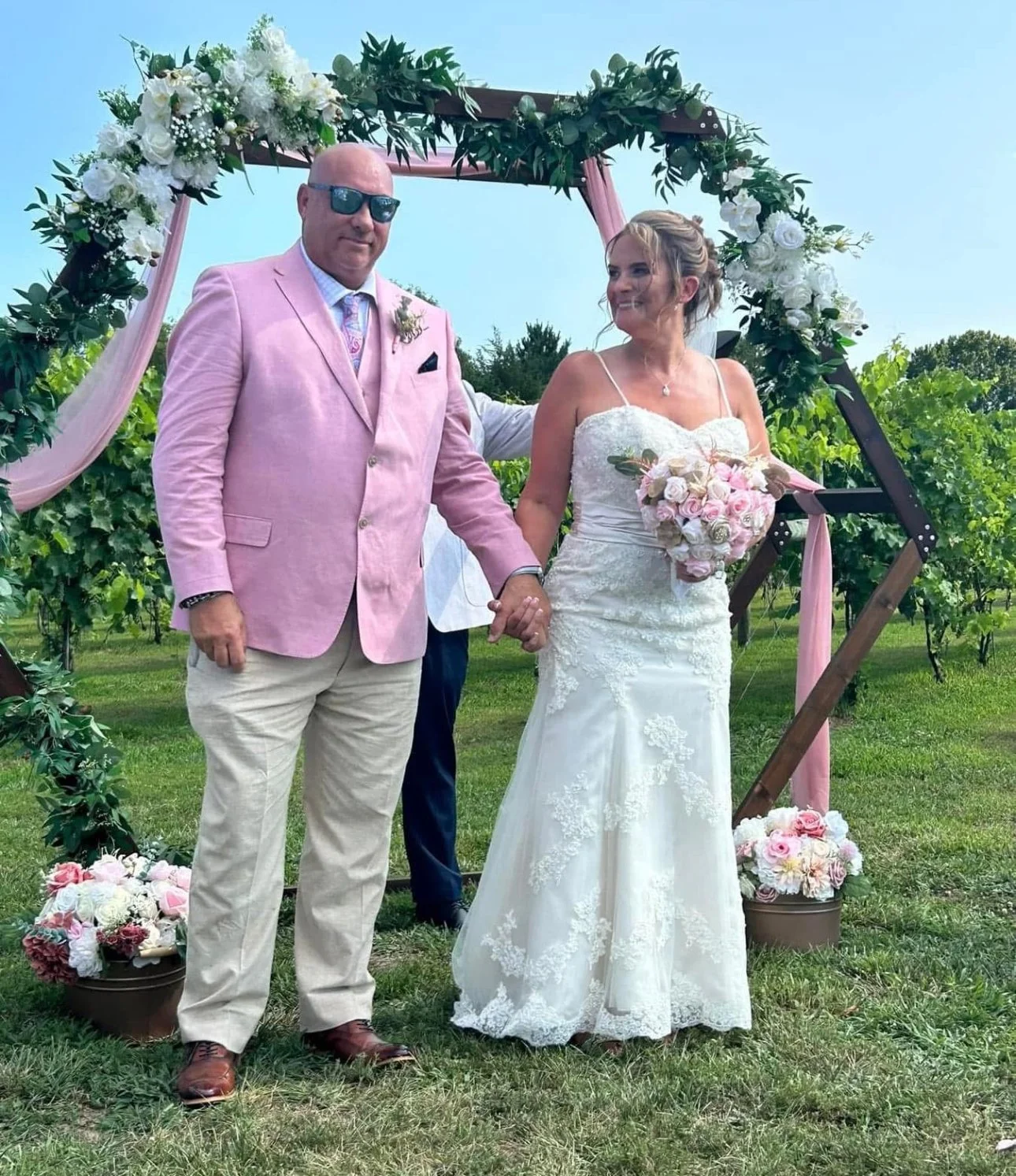 A bride and groom holding rat