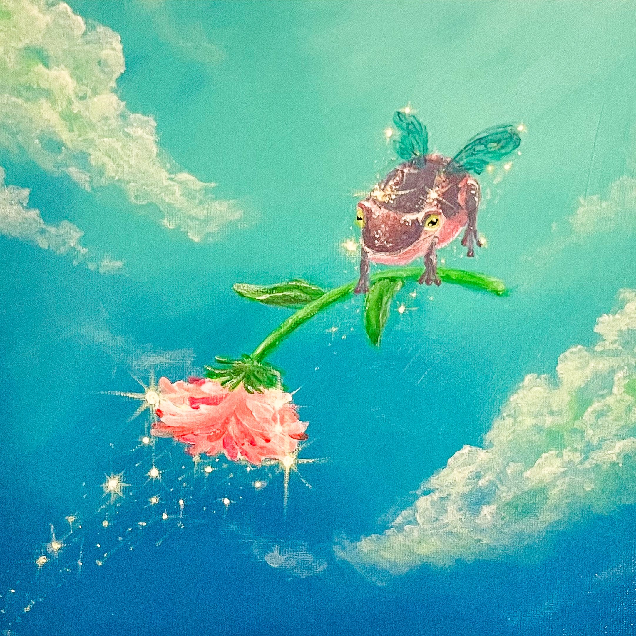 A colorful painting of a purple frog with wings, flying against a blue sky with clouds, with star-like sparkles and holding a pink sparkling flower.