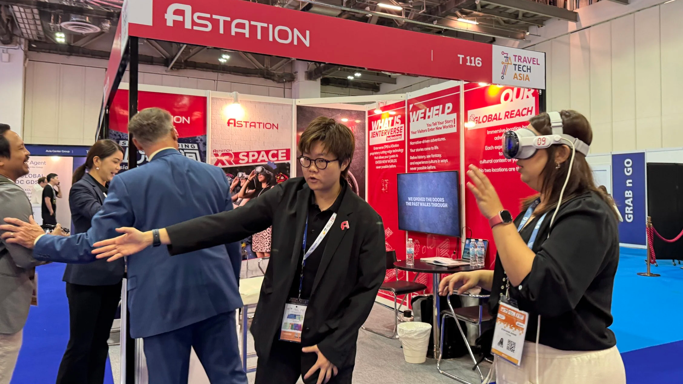 Pinpoint PR helped launch AStation, bringing media to experience their Interverse technology at ITB Asia 2025. People engaging at a trade booth labeled 'ASTATION' at a convention or expo, with informational displays and a woman wearing a VR headset.