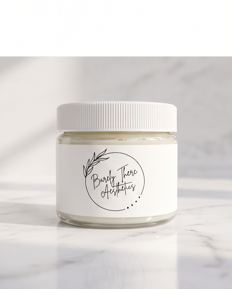 A jar labeled "Barely There Aesthetics" with a white lid on a marble surface, with a light background.