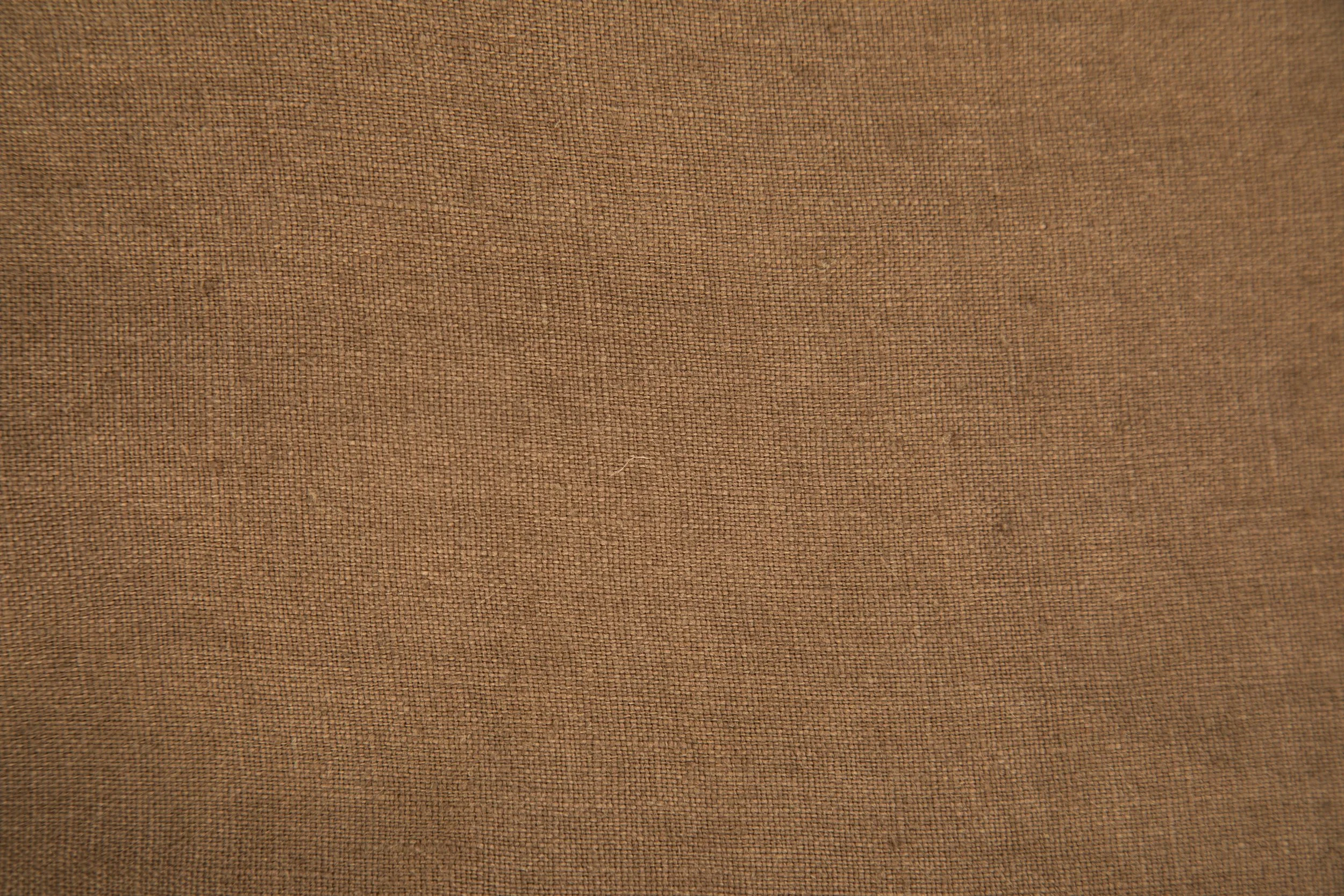 therapy for trauma picture of a close-up image showing a textured brown fabric surface.