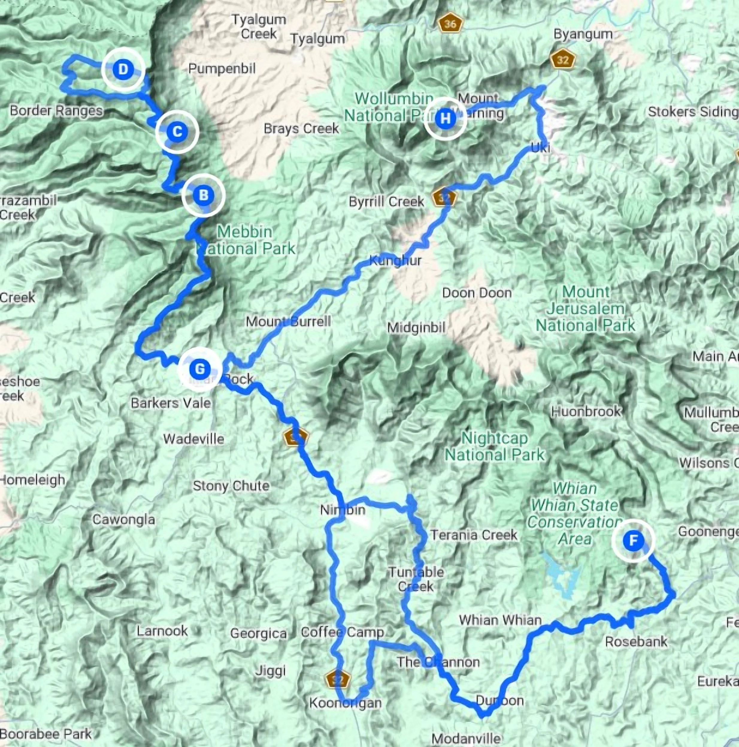 A topographic map showing a travel route through national parks and towns, with a blue path marked by points labeled G to D and F, and various mountain features and landmarks such as Mount Jerusalem, Mount Bureen, and Namk.