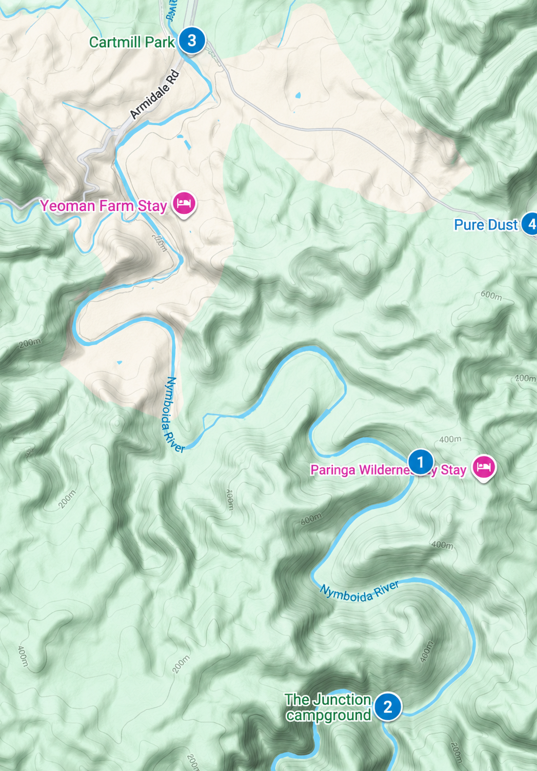 Map of a hiking area featuring the Nymboida River, with locations including Paringa Wilderness Stay, Yeoman Farm Stay, Cartment Park, and The Junction campground. The map shows terrain elevation with contour lines.