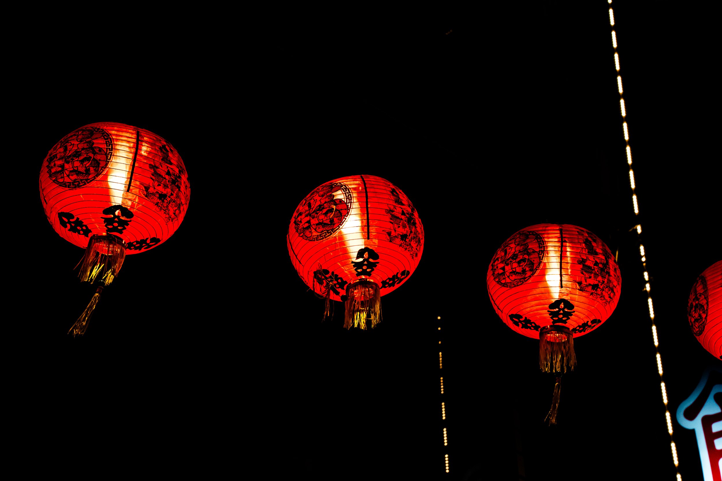Red Chinese lanterns hanging at night.