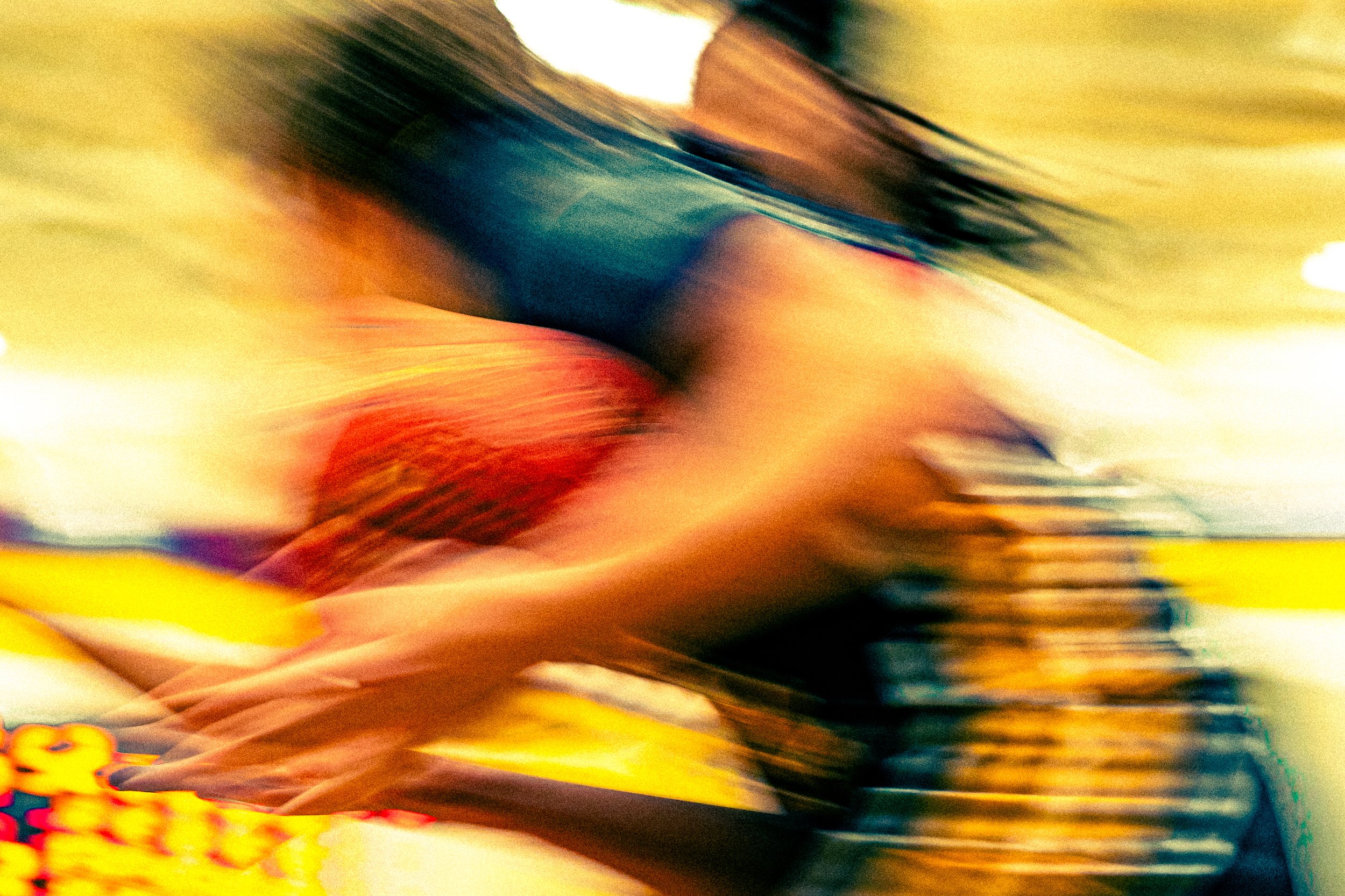 Blurred image of colorful candies or snacks on a store shelf.