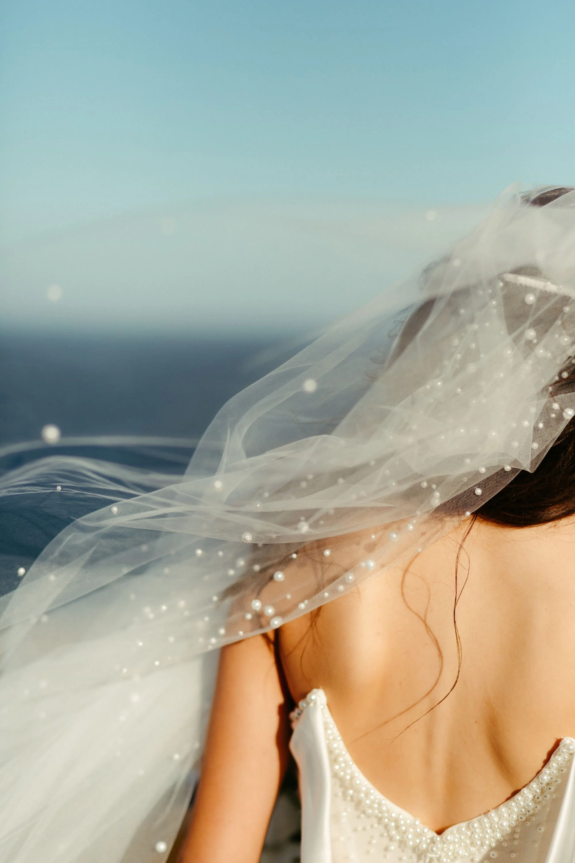 A beautiful bride looking at the ocean in Bremer Bay WA