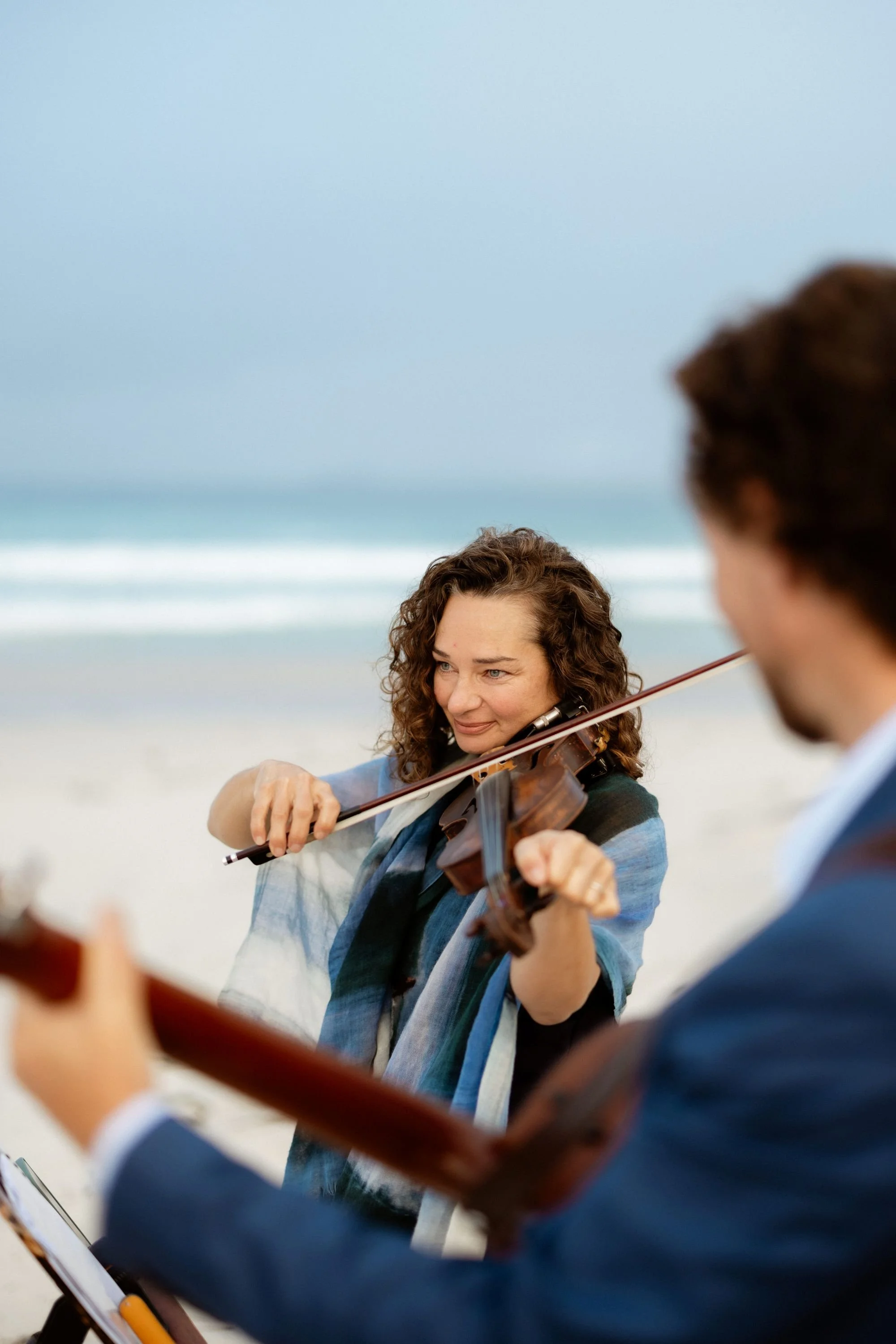 Violinist Alma Limondin playing classical music at the beach in Albany WA