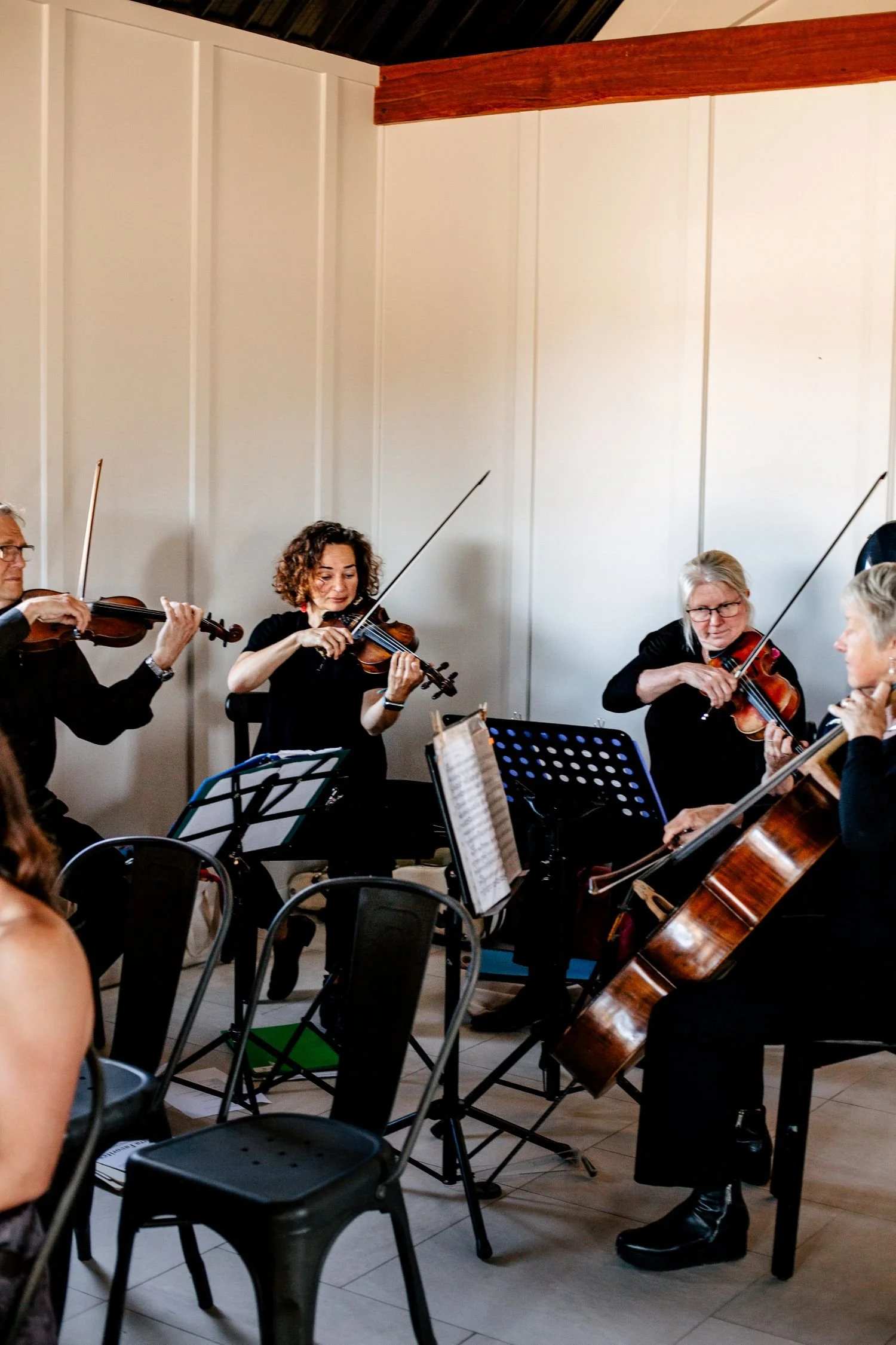 A string quartet playing classial music for a corporate event