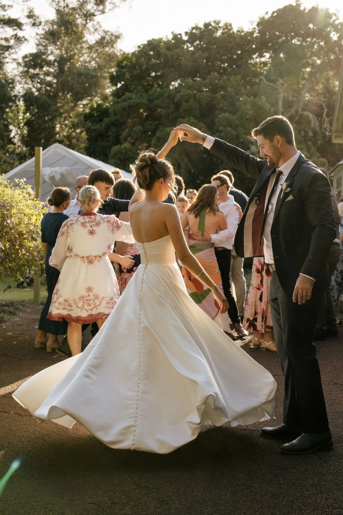A bride and groom dancing to live wedding cocktail hour music