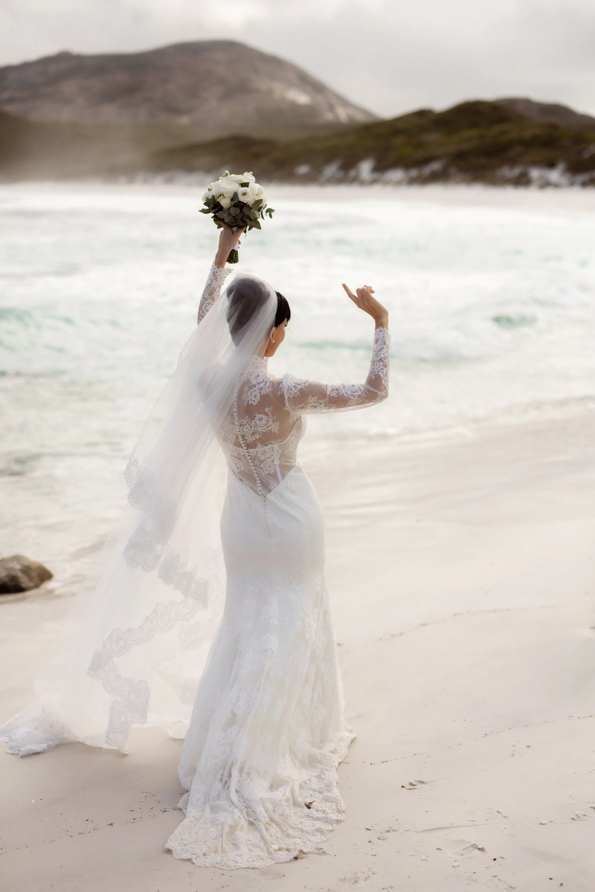 A bride dancing on the beach to  classical wedding music