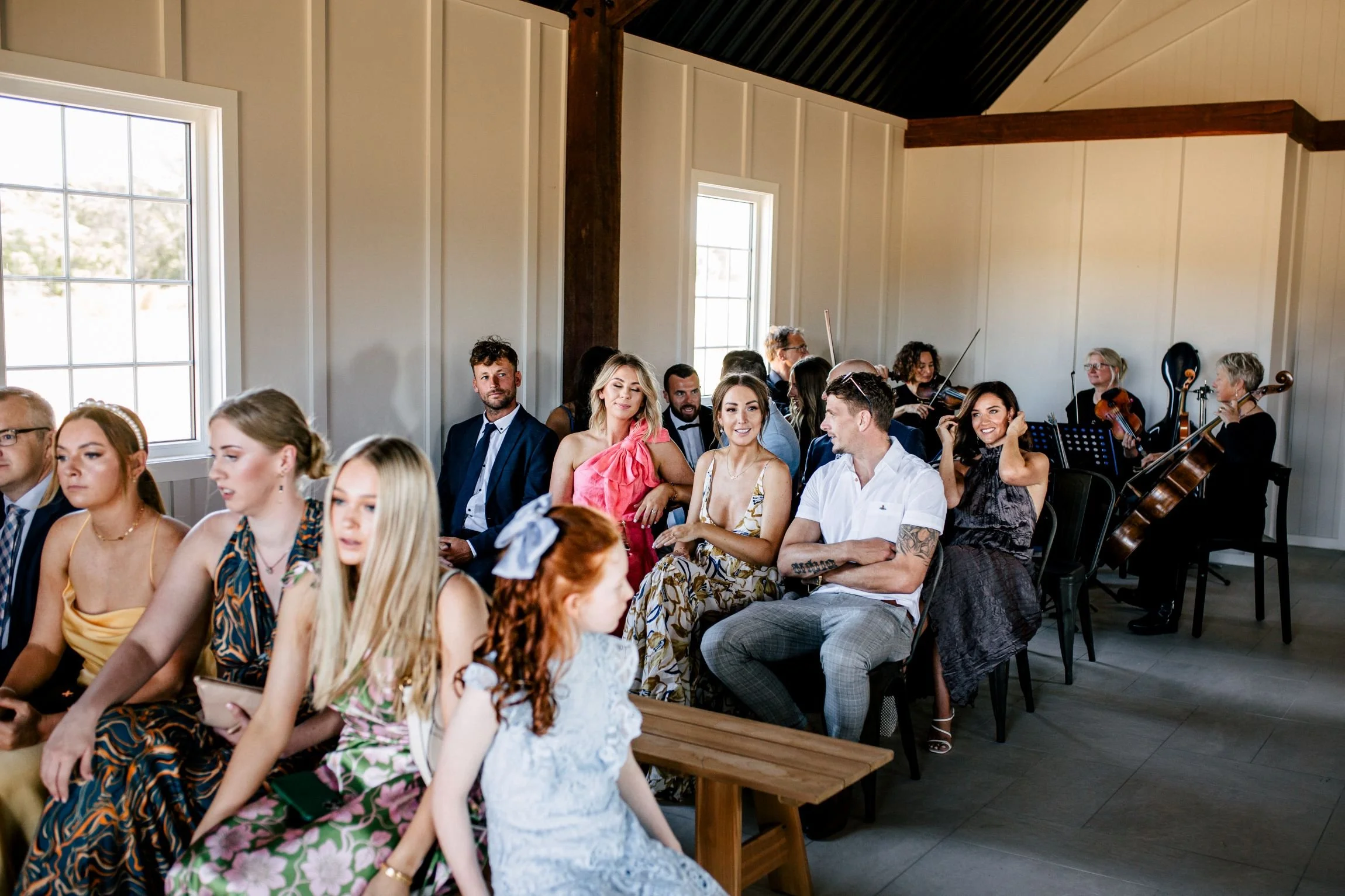Guests waiting excitedly and listening to pre-ceremony music at a wedding in Denmark WA