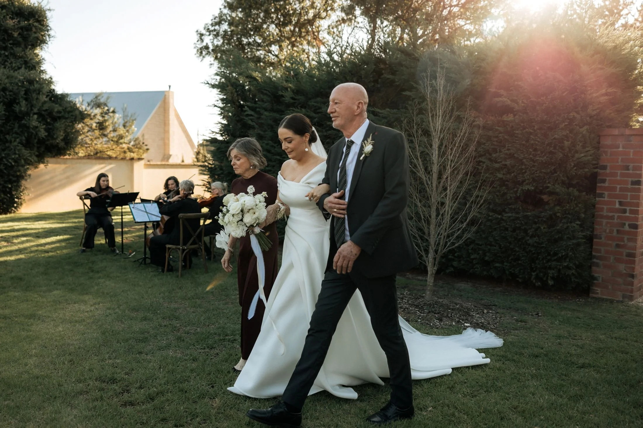 A bride walking down the aisle to live ceremony music