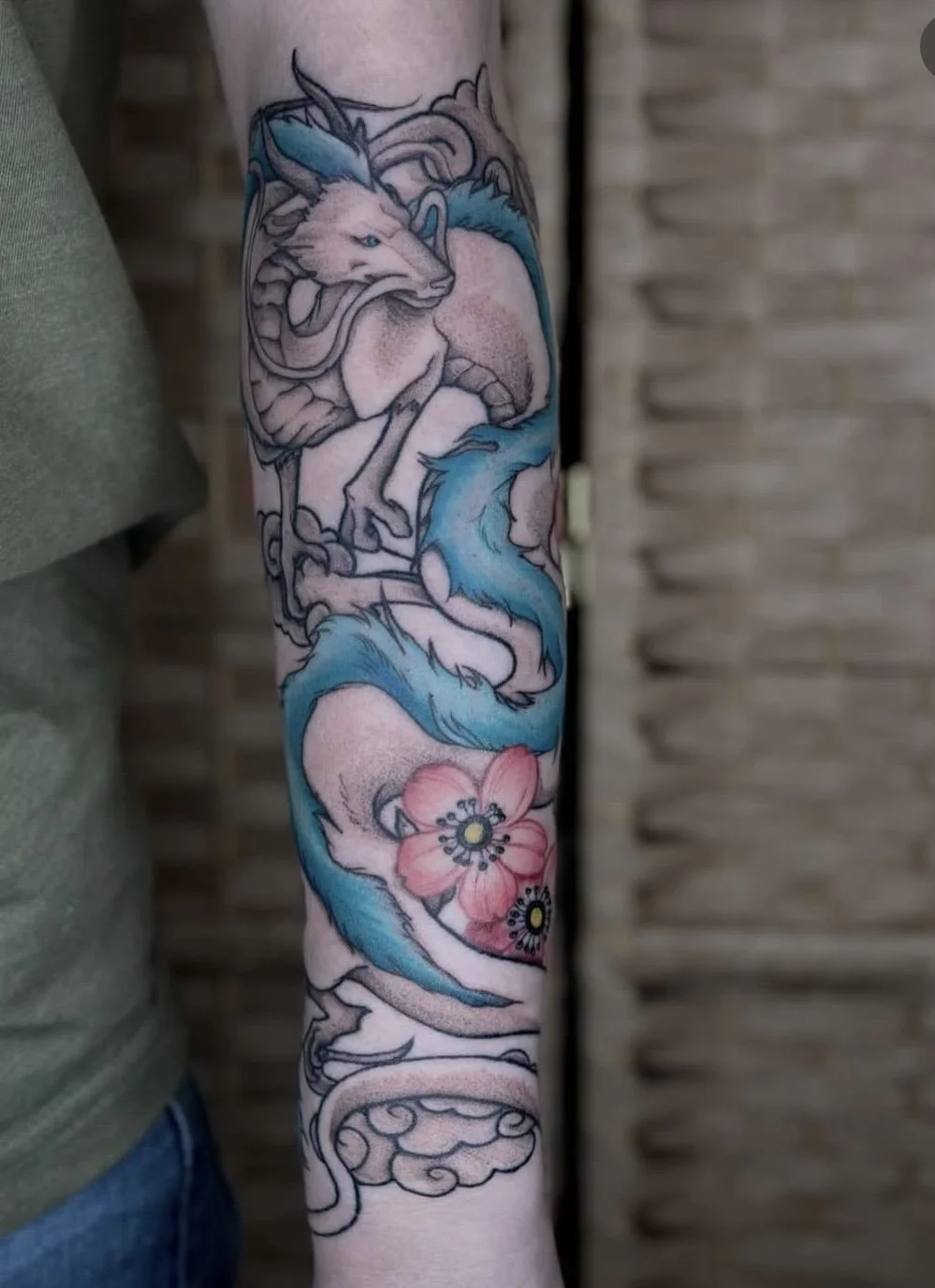 Colored Haku dragon tattoo with cherry blossoms