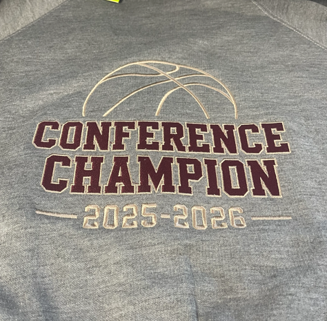 Gray cardigan with maroon and Vegas gold embroidered text that reads 'Conference Champion 2025-2026' and a basketball logo on the full back.