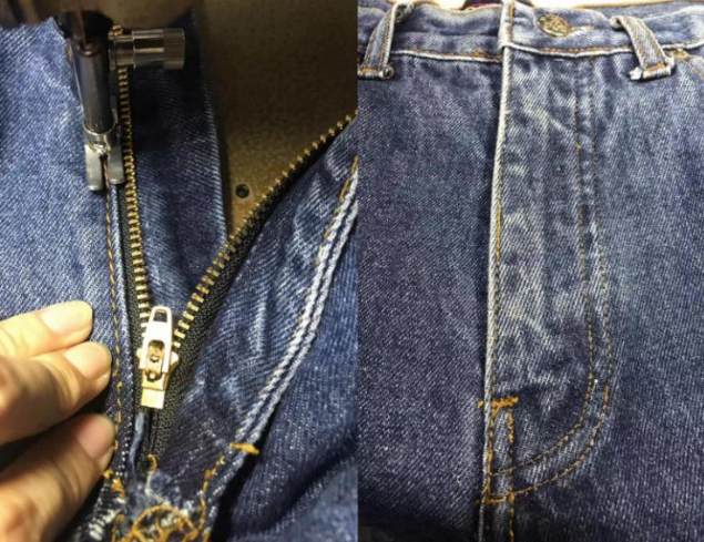Close-up of a person unzipping a pair of blue jeans with the zipper partially open, revealing the dark interior of the jeans.