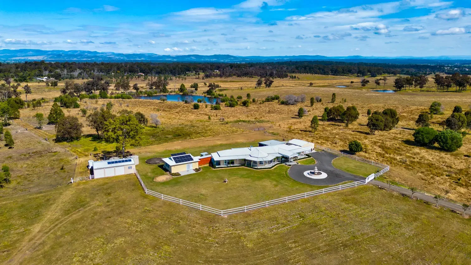 Drone photograph of a rural acreage property in South East Queensland showcasing land, landscape and real estate photography.