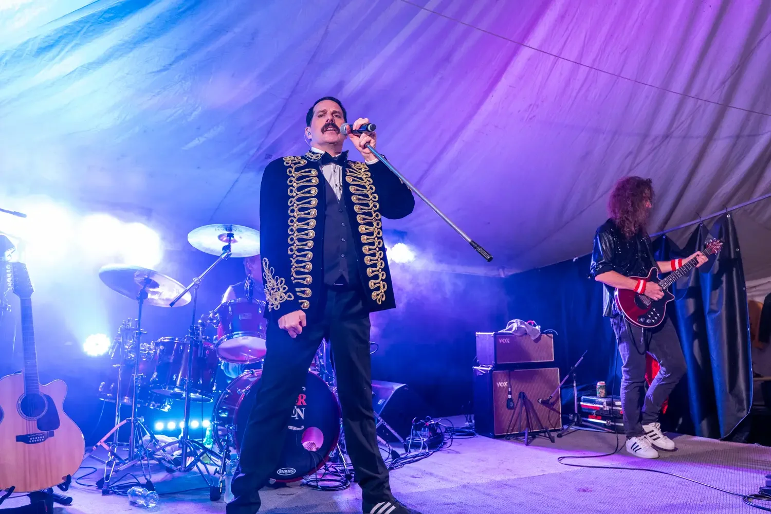 Live music performance photographed under a marquee during a regional event in South East Queensland.