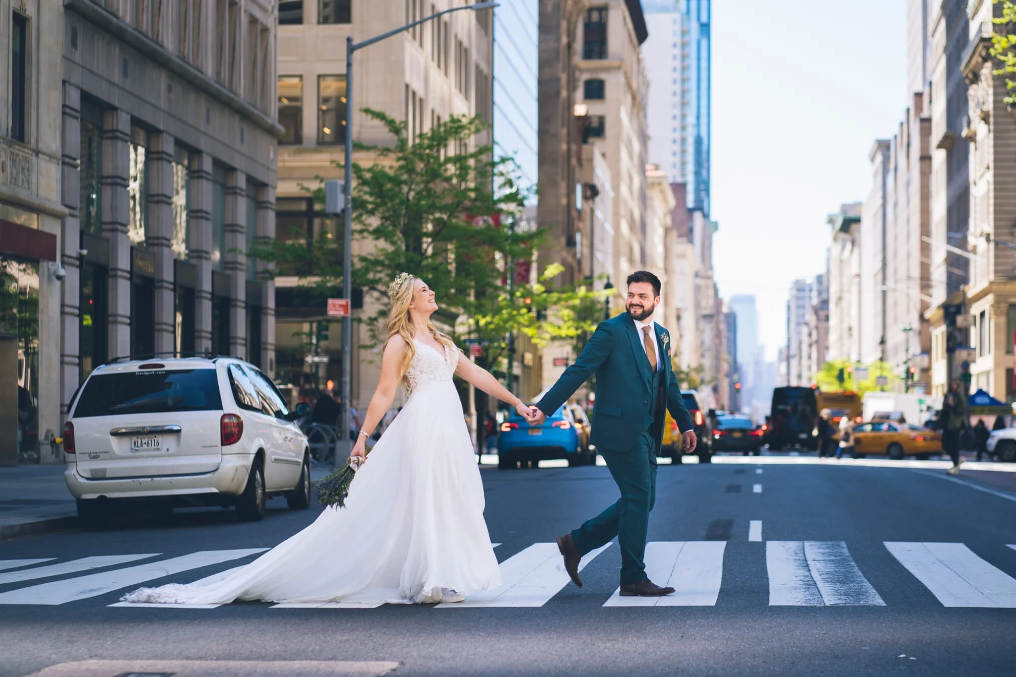 The bride and groom taking a stroll through NYC @SaschaReinkingPhotography