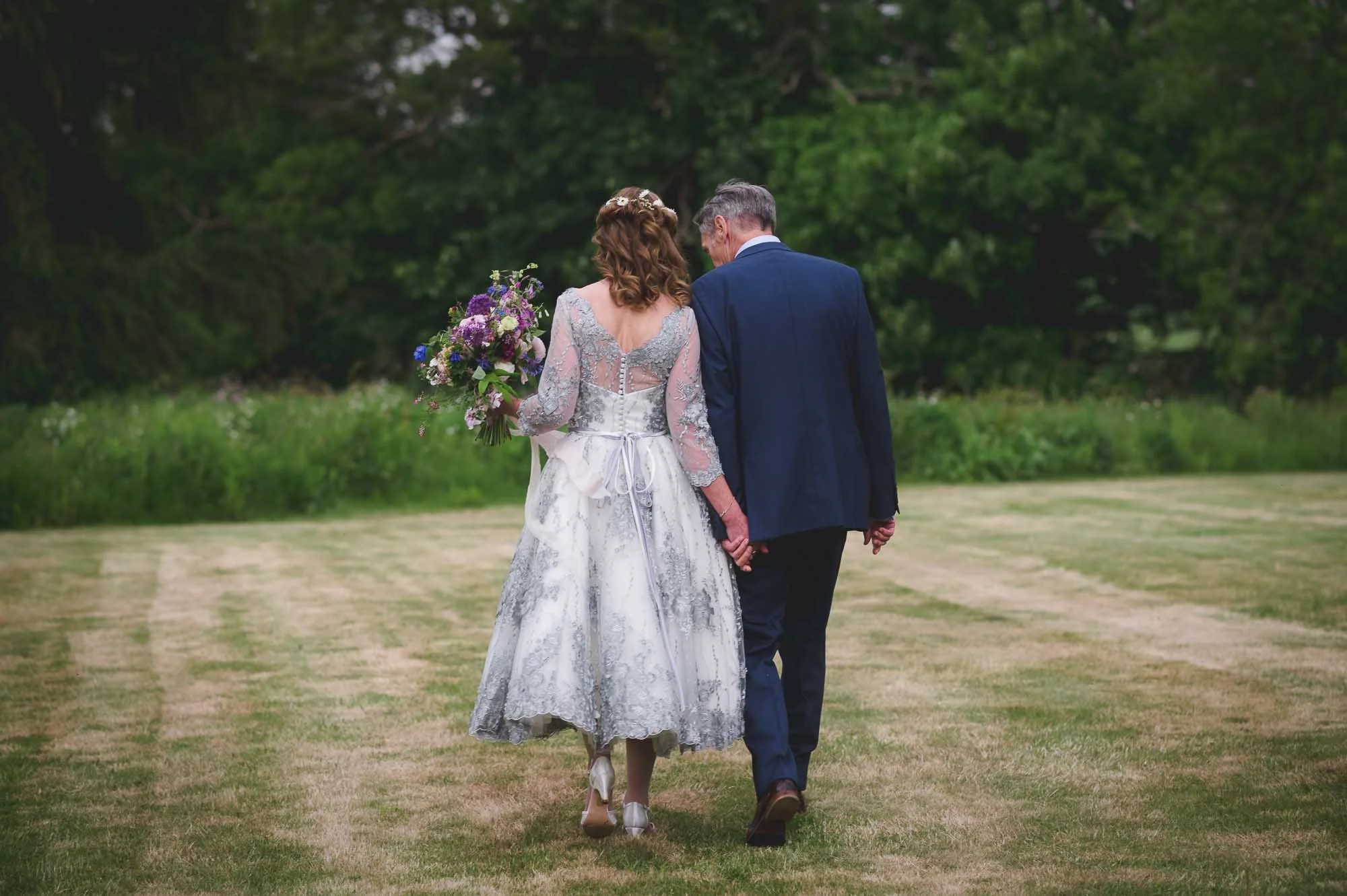 The exquisite detailing on the back on Sybil completes the look of this beautiful moment @Nick Brightman Photography