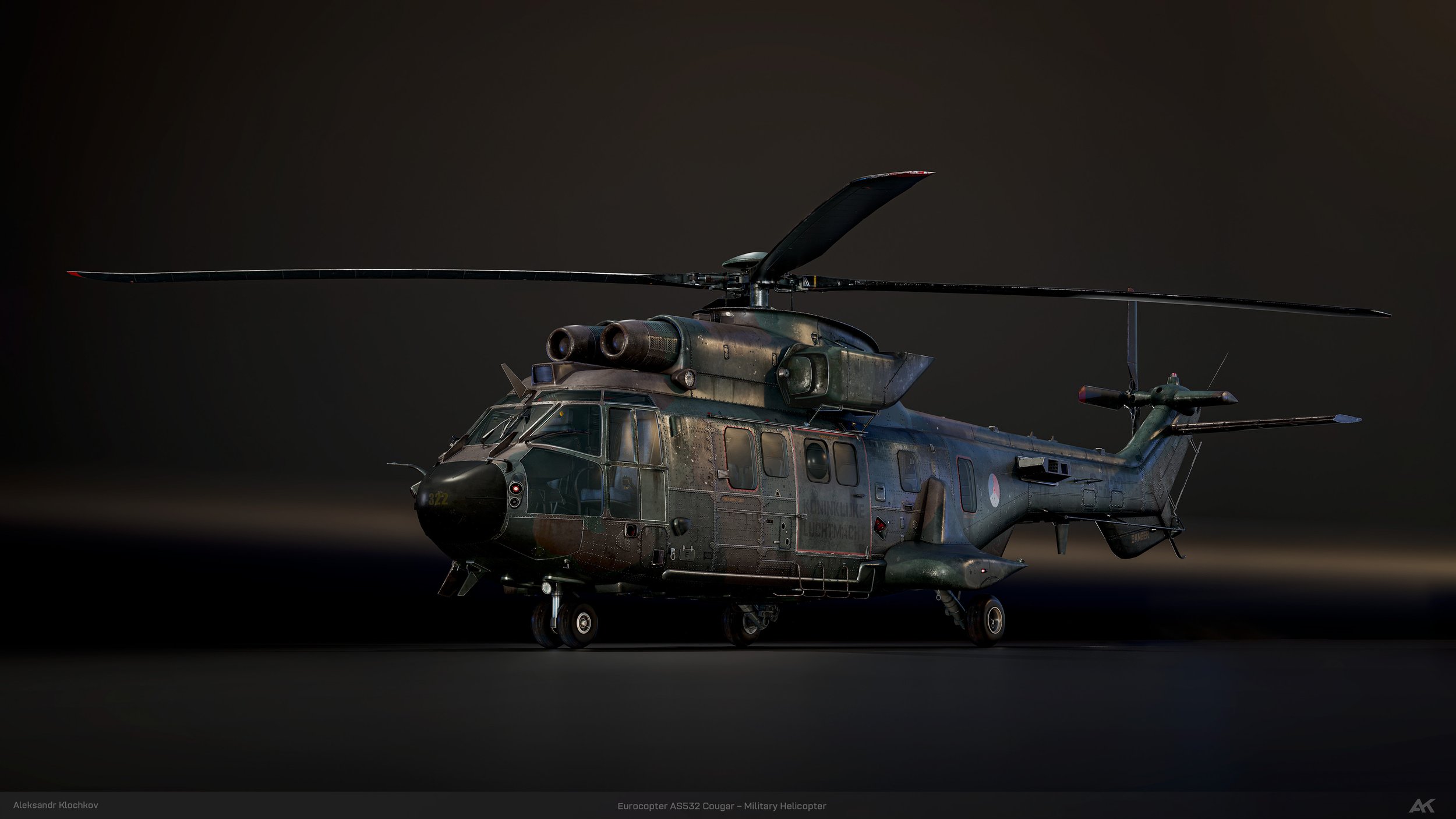 A military helicopter, model Eurocopter AS532 Cougar, painted in camouflage colors, is viewable against a dark background with landing gear extended.