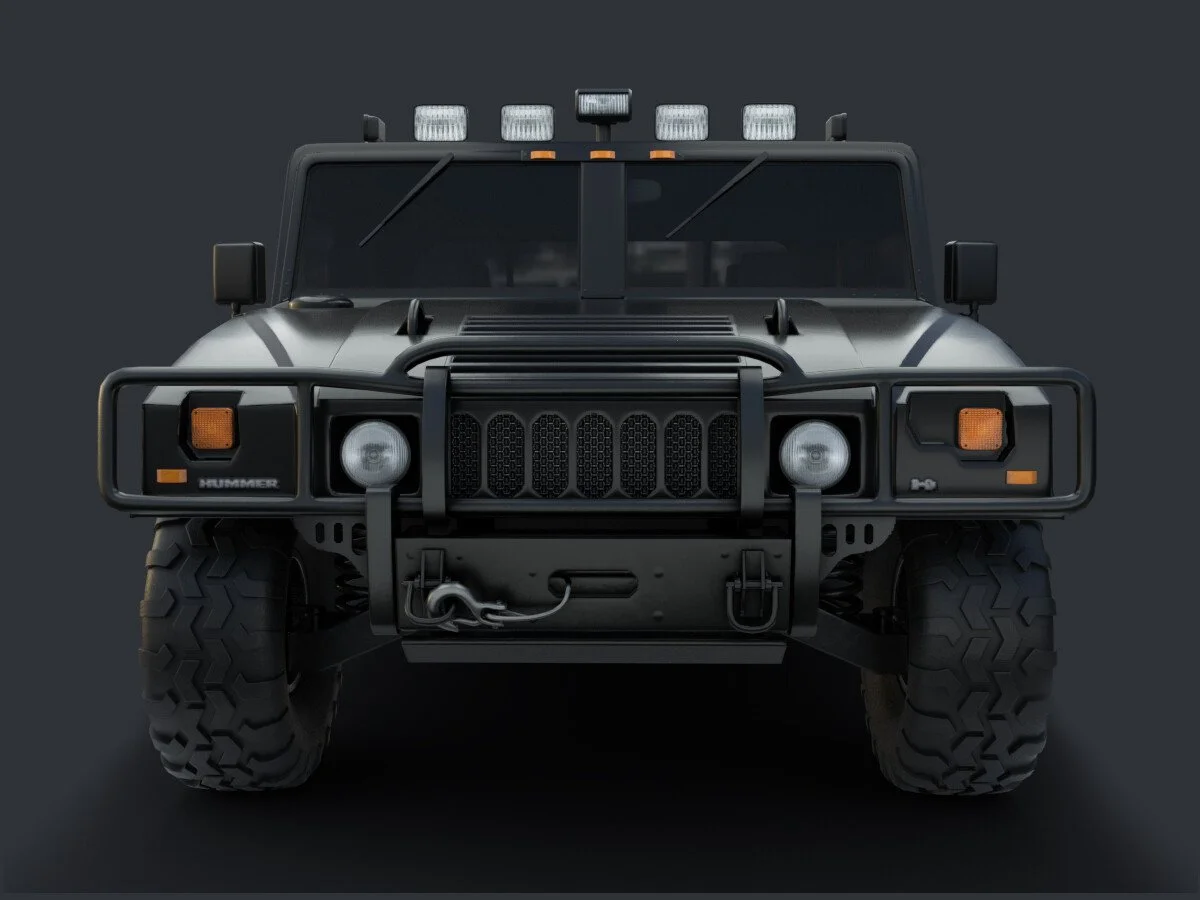 Front view of a black military or off-road vehicle with large tires, grille guard, multiple lights on the top, and a winch on the front bumper.