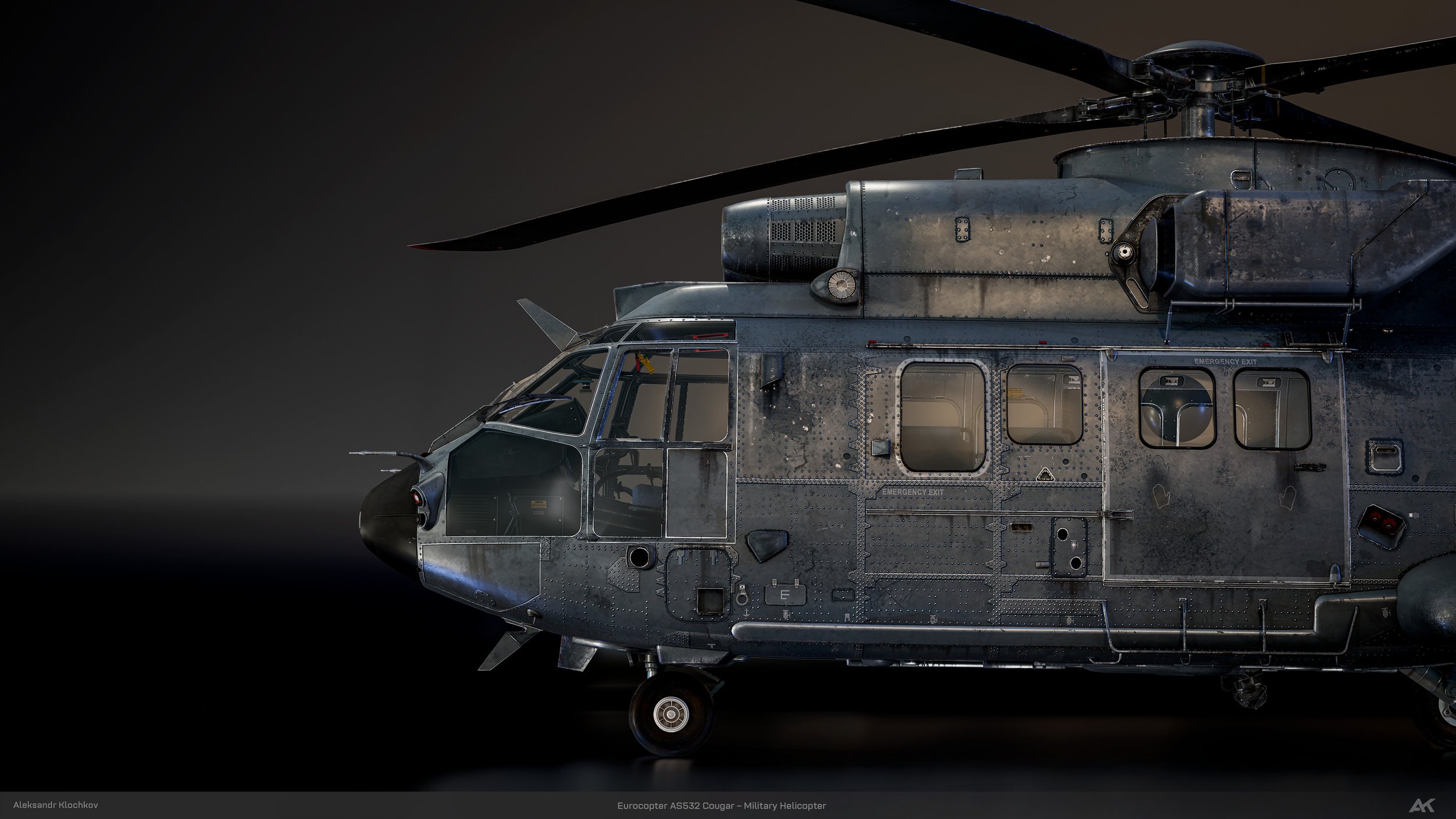 Close-up view of a military helicopter, Eurocopter AS532 Cougar, showing the cockpit, rotor blades, and parts of the fuselage against a dark background.