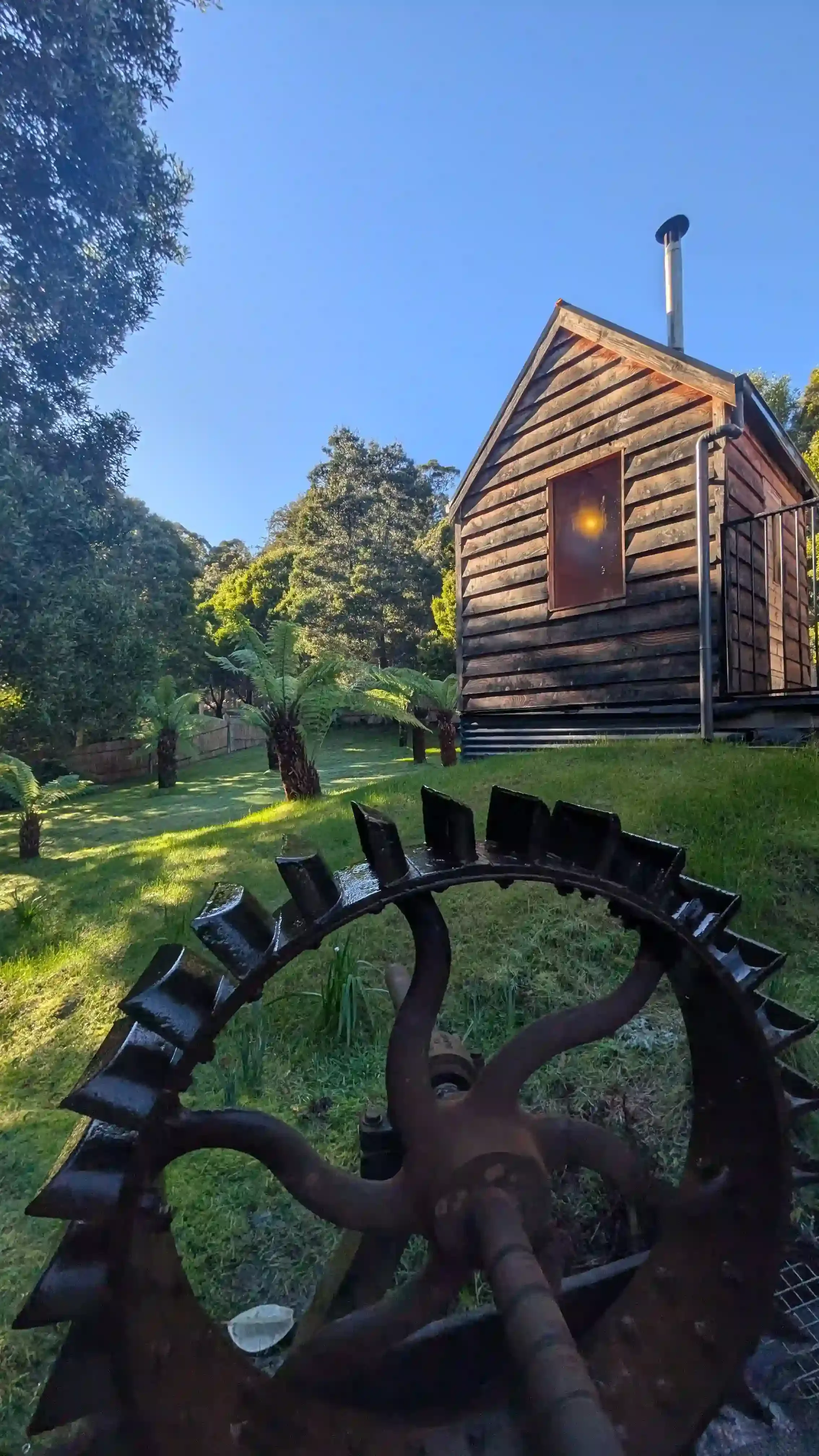 The private tailrace sauna and cold plunge amongst the bush landscape near Derby, north east Tasmania