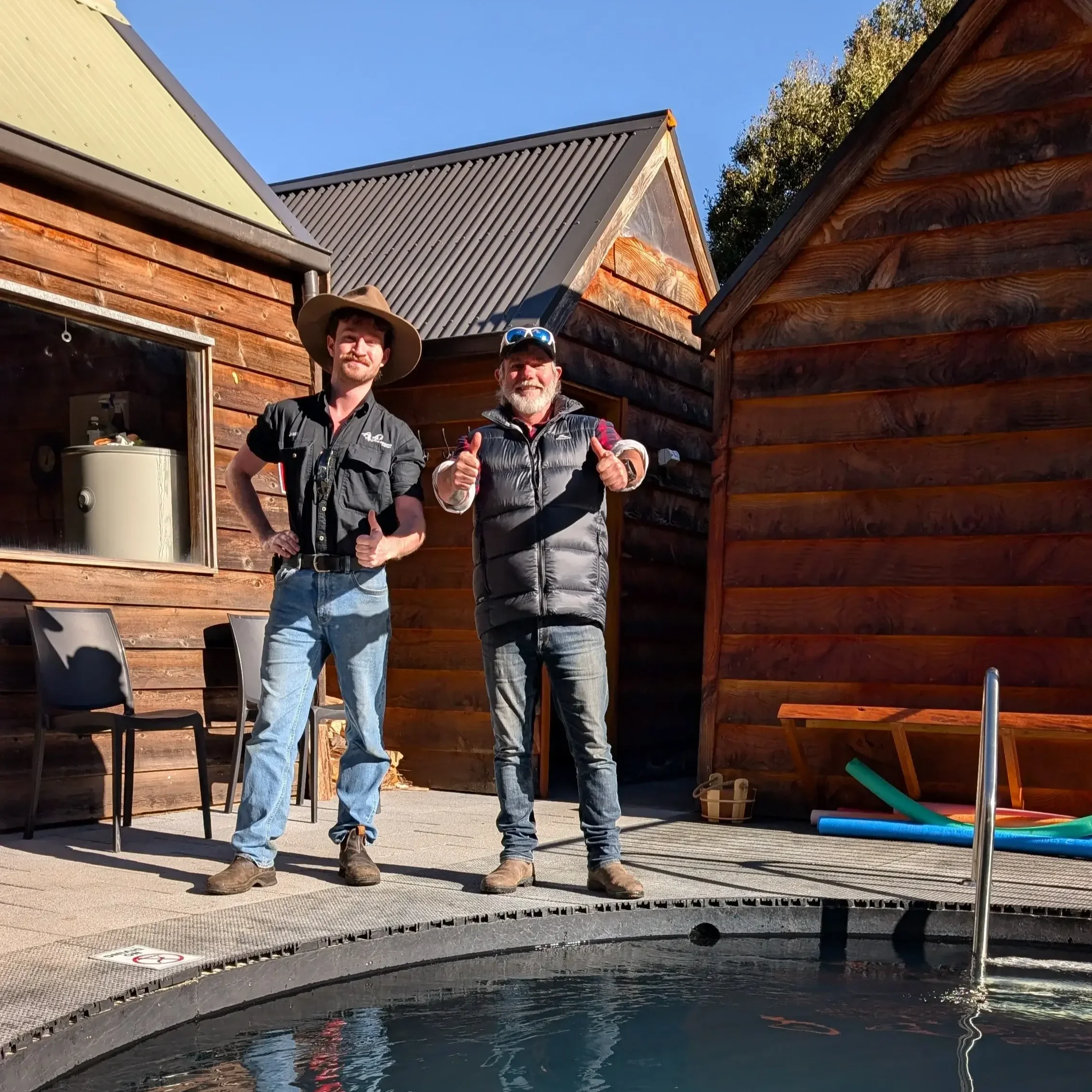 Graham Cahill from 4wd247 and owner James Cashion standing outside the cold plunge pool at the tailrace sauna near Derby, Northern Tasmania.
